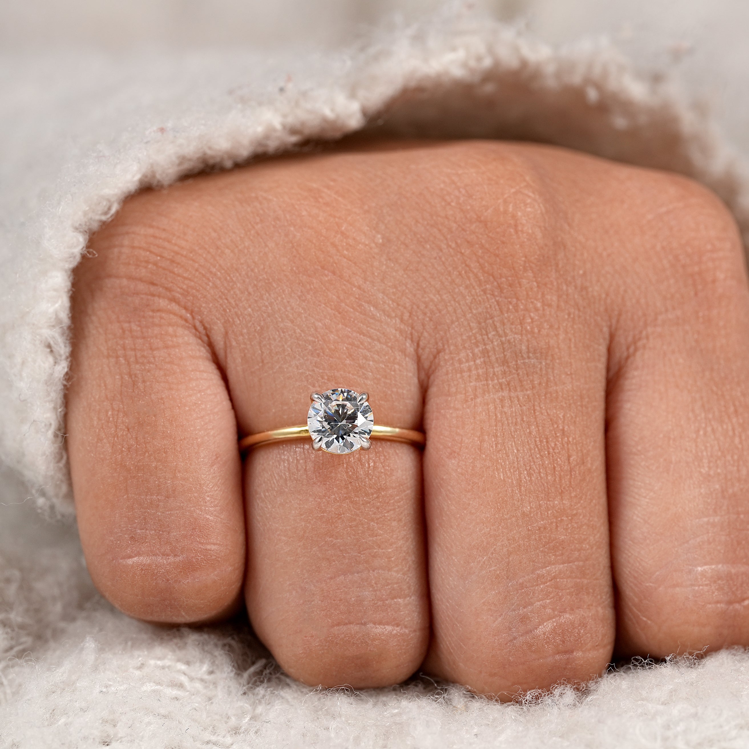Minimalist bridal ring featuring round solitaire diamond and slim gold band