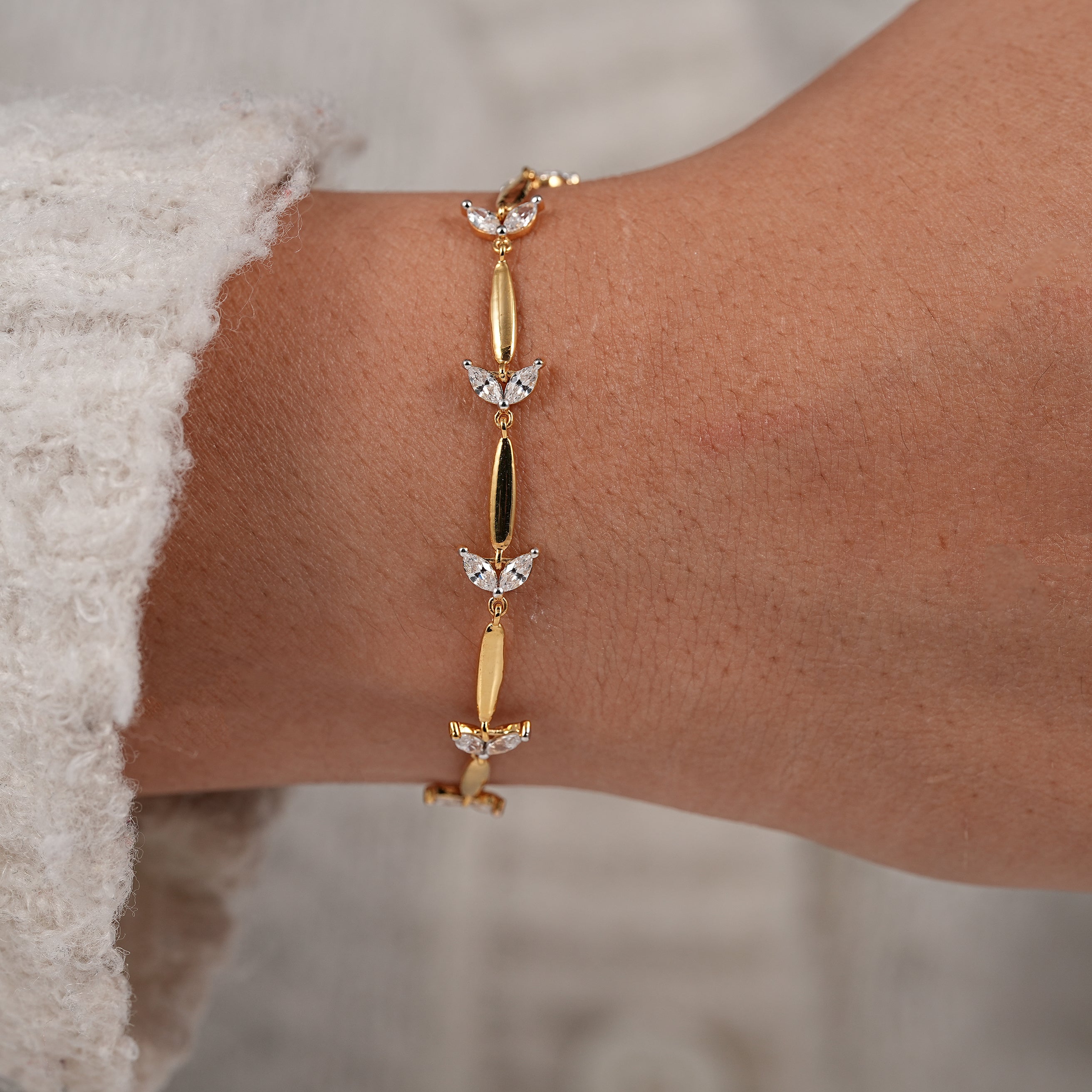 Delicate yellow gold bracelet with marquise lab created diamond details