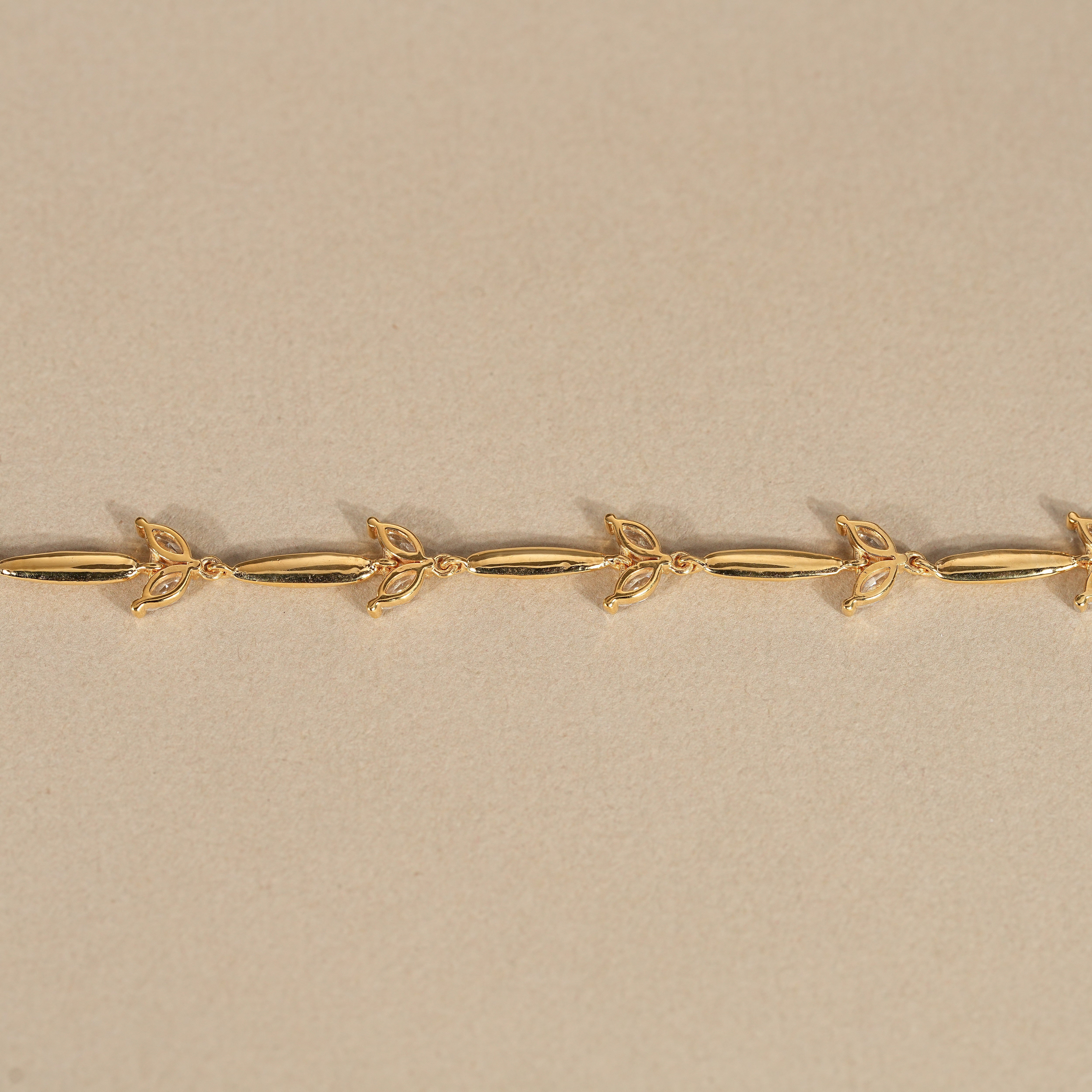 Minimalist diamond bracelet with alternating gold bar and marquise accents