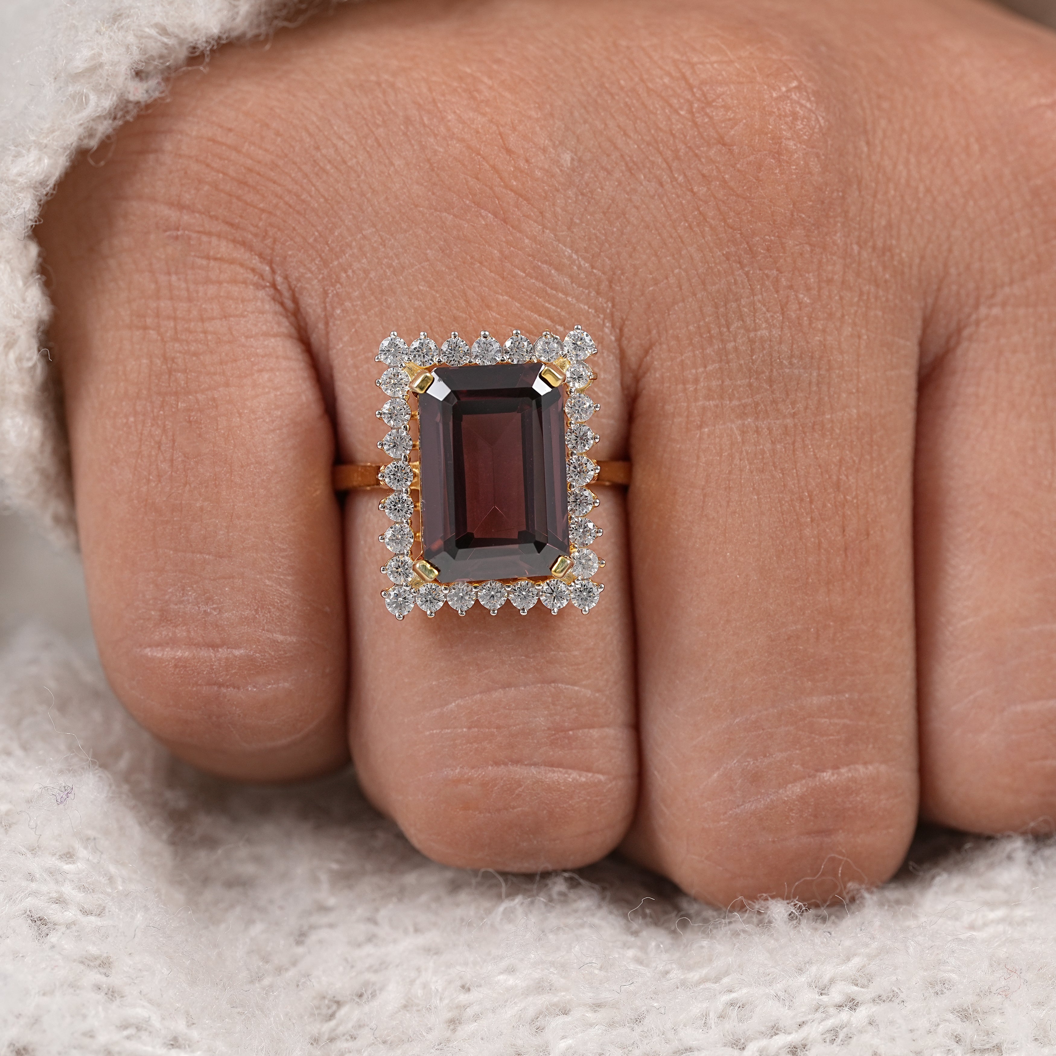 Luxury emerald cut garnet ring with pavé diamond halo and yellow gold design