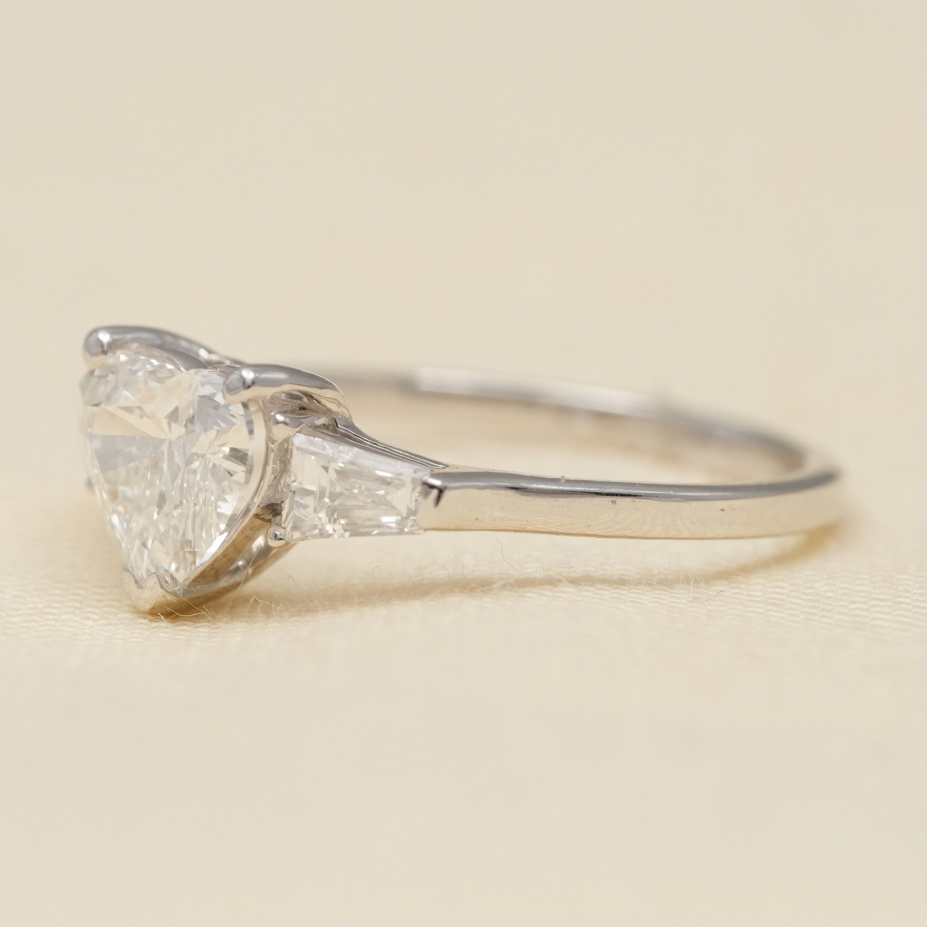 Elegant heart cut ring designed with lab grown diamond baguette accents