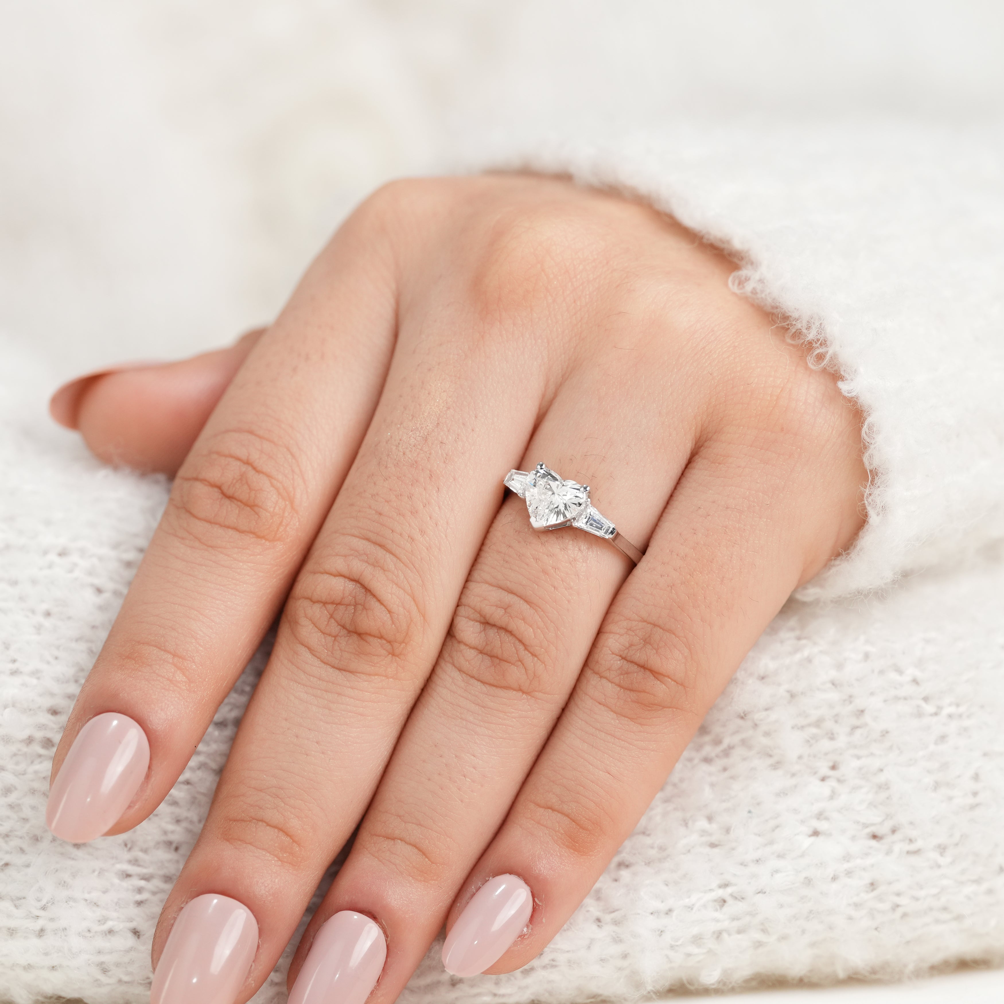 Refined heart shaped ring featuring lab grown diamond and baguette details