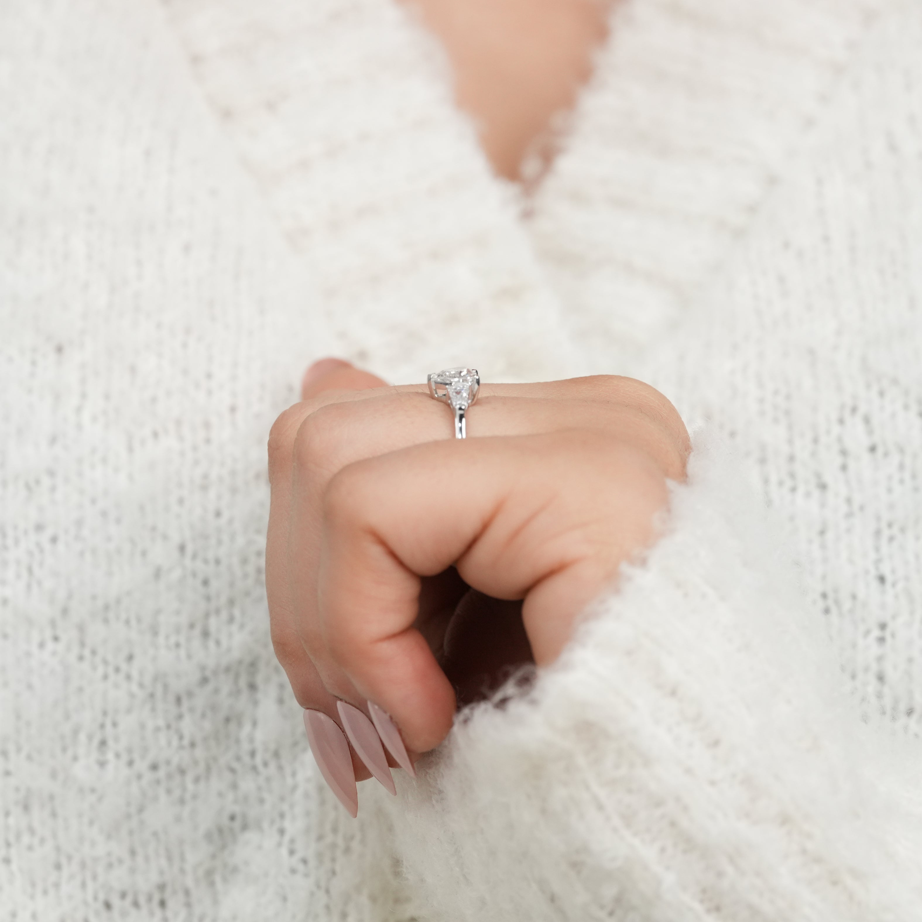 Classic heart cut ring showcasing sparkling lab grown diamond side baguettes