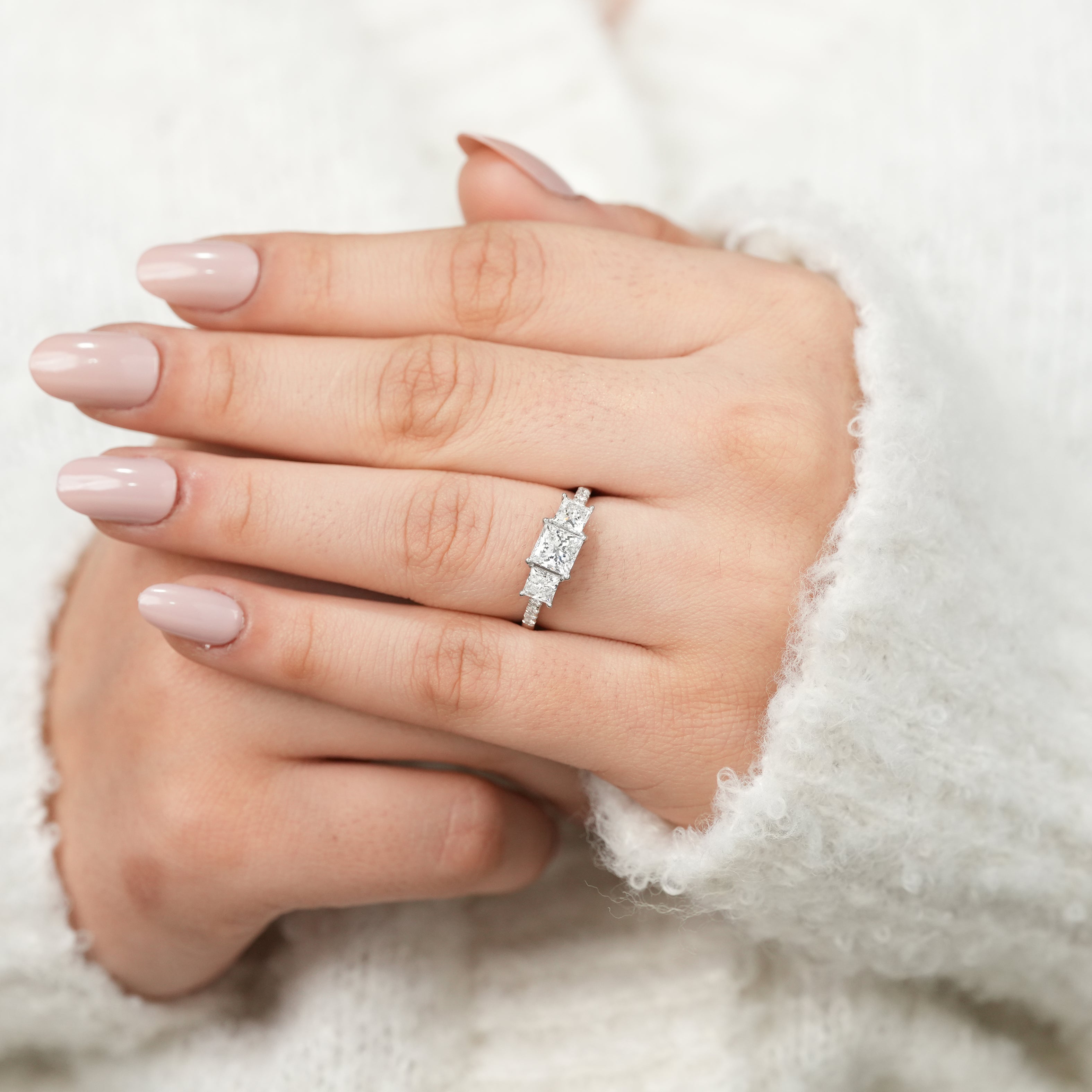 Princess cut three stone ring showcasing elegant lab grown diamond arrangement