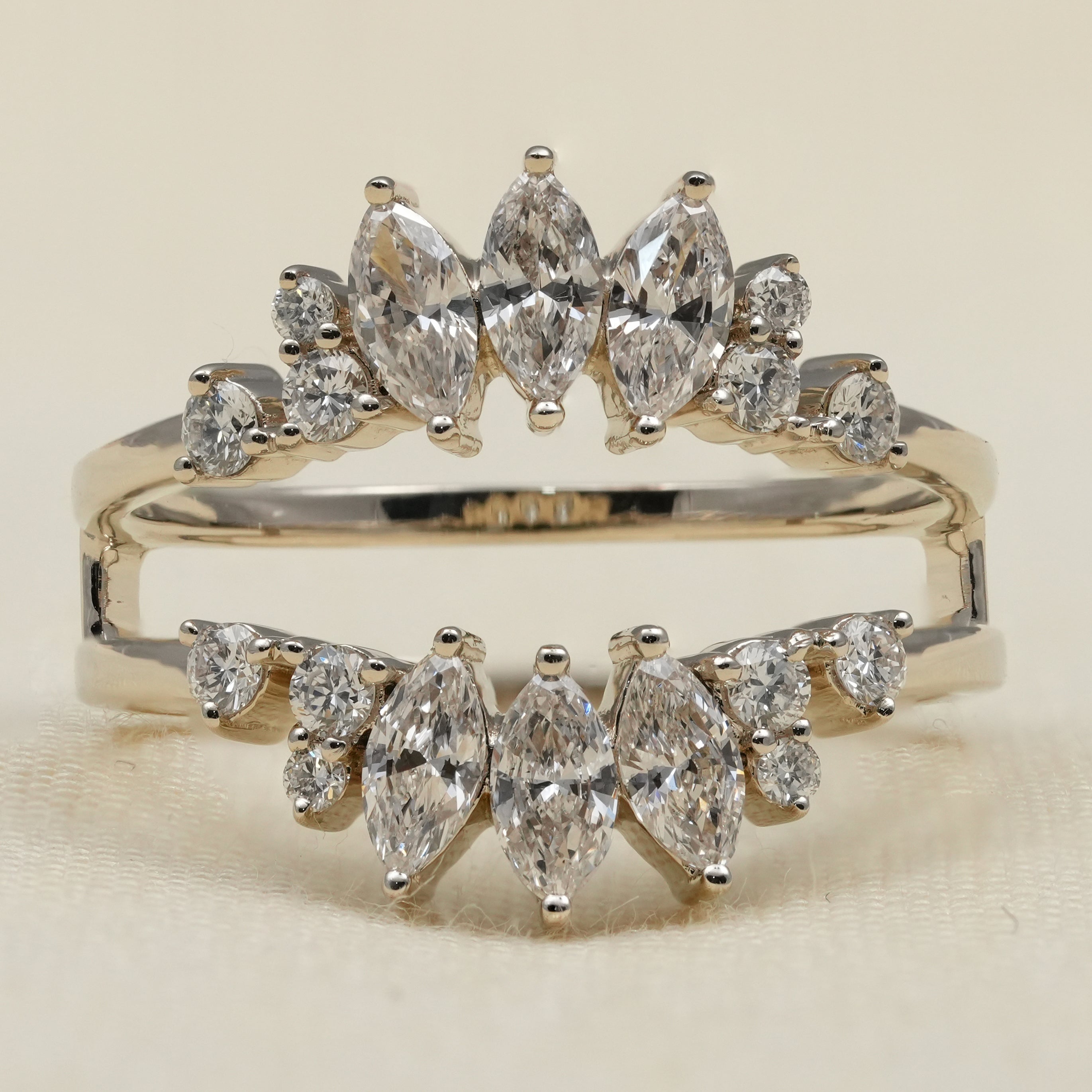 Chevron style ring featuring marquise lab grown diamonds with round accents