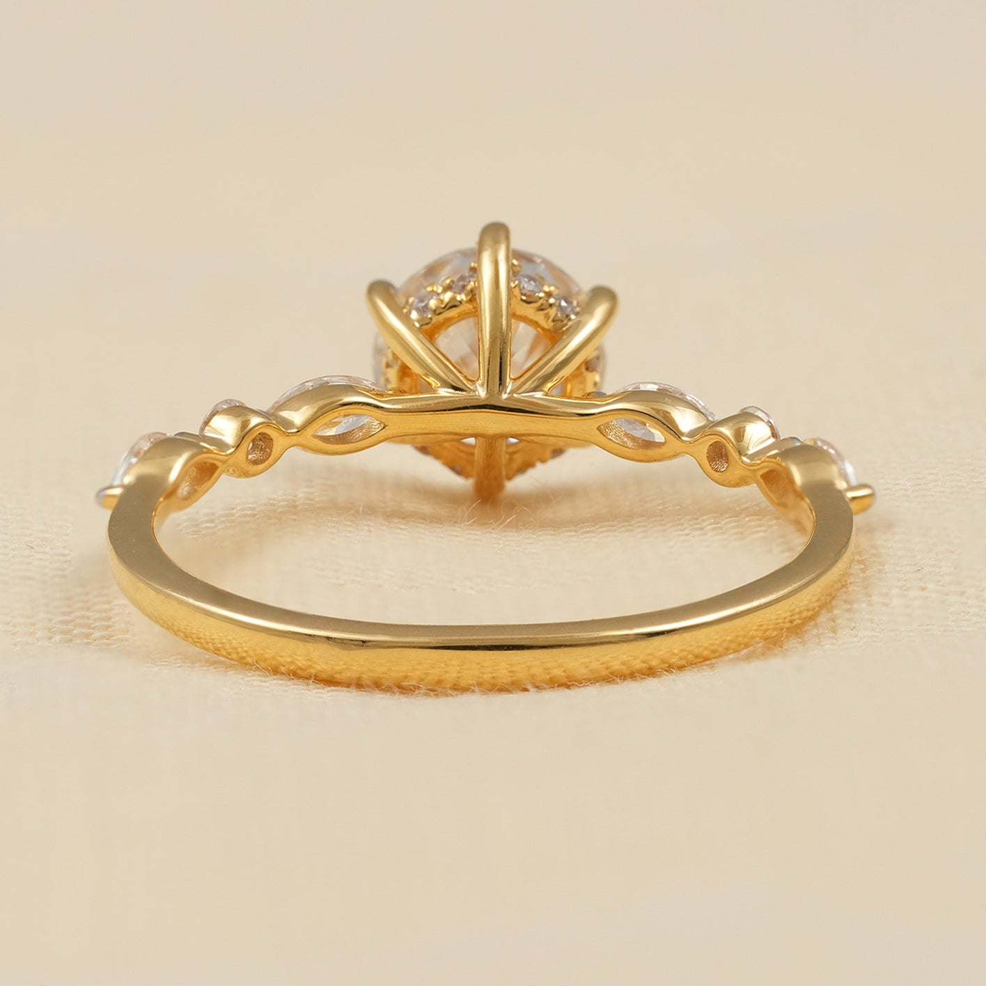 Round Cut Diamond Ring with Marquise Accent Stones in Gold