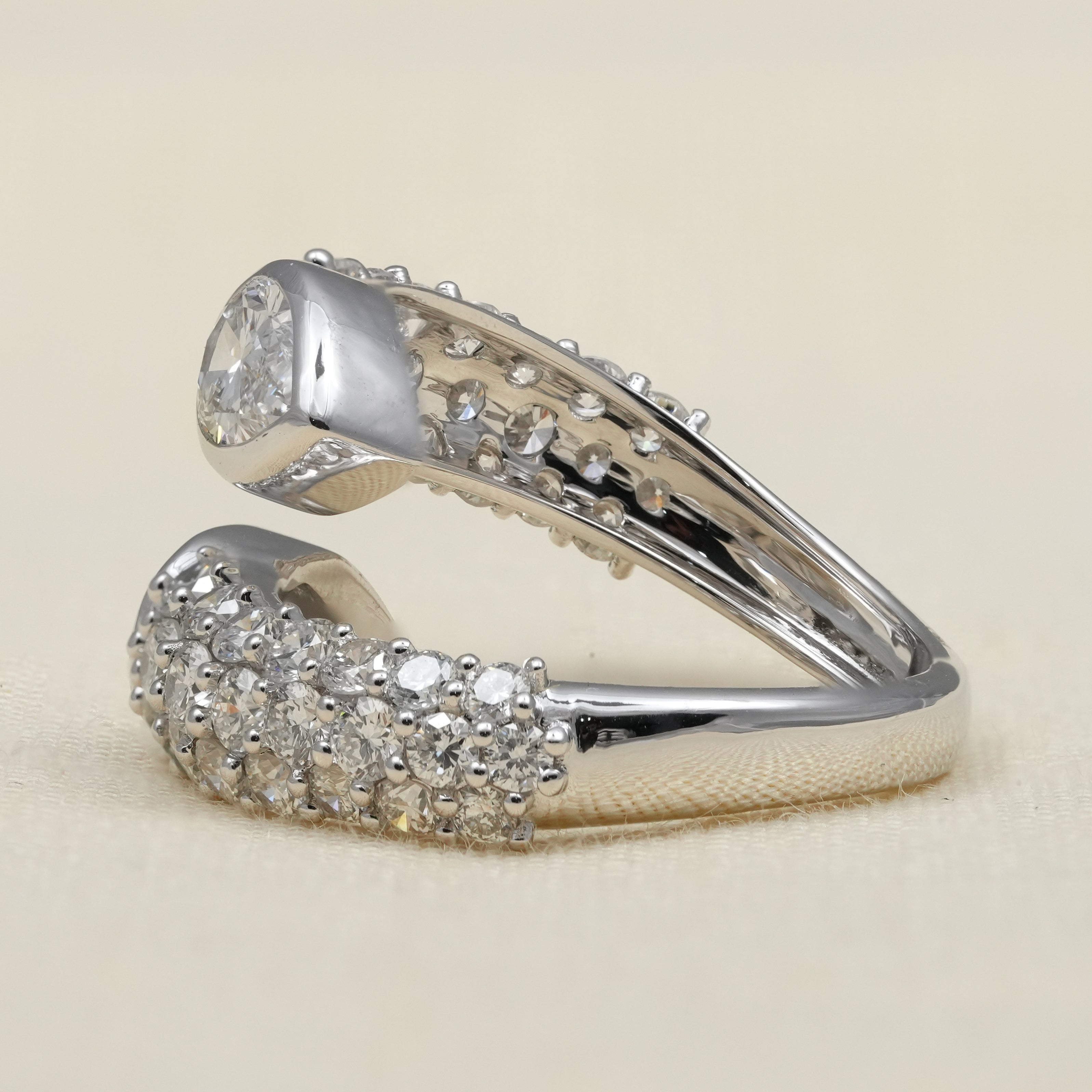 Contemporary open band ring highlighting pear lab grown diamond brilliance