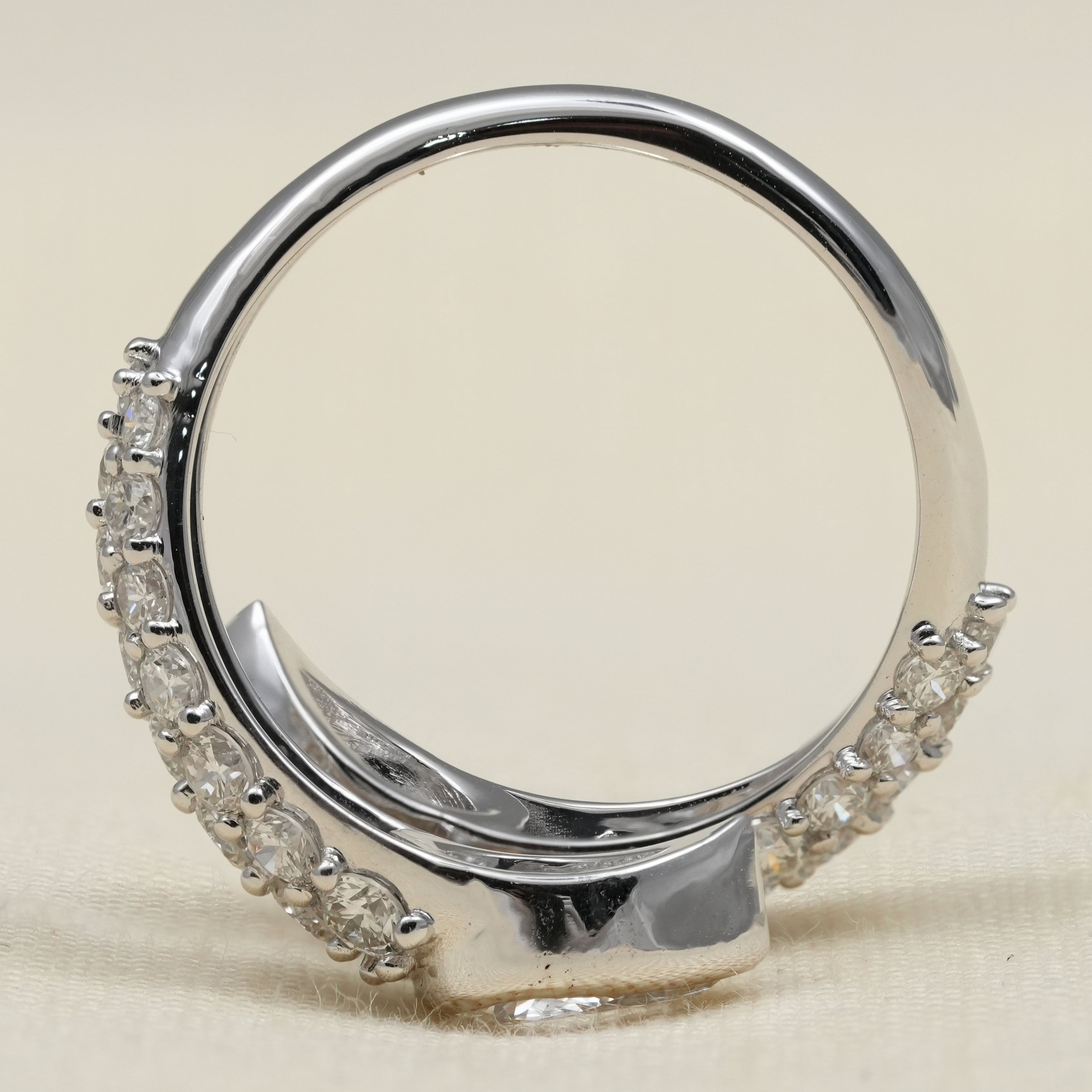 Stylish bypass ring with pear shaped lab grown diamonds pavé detailing