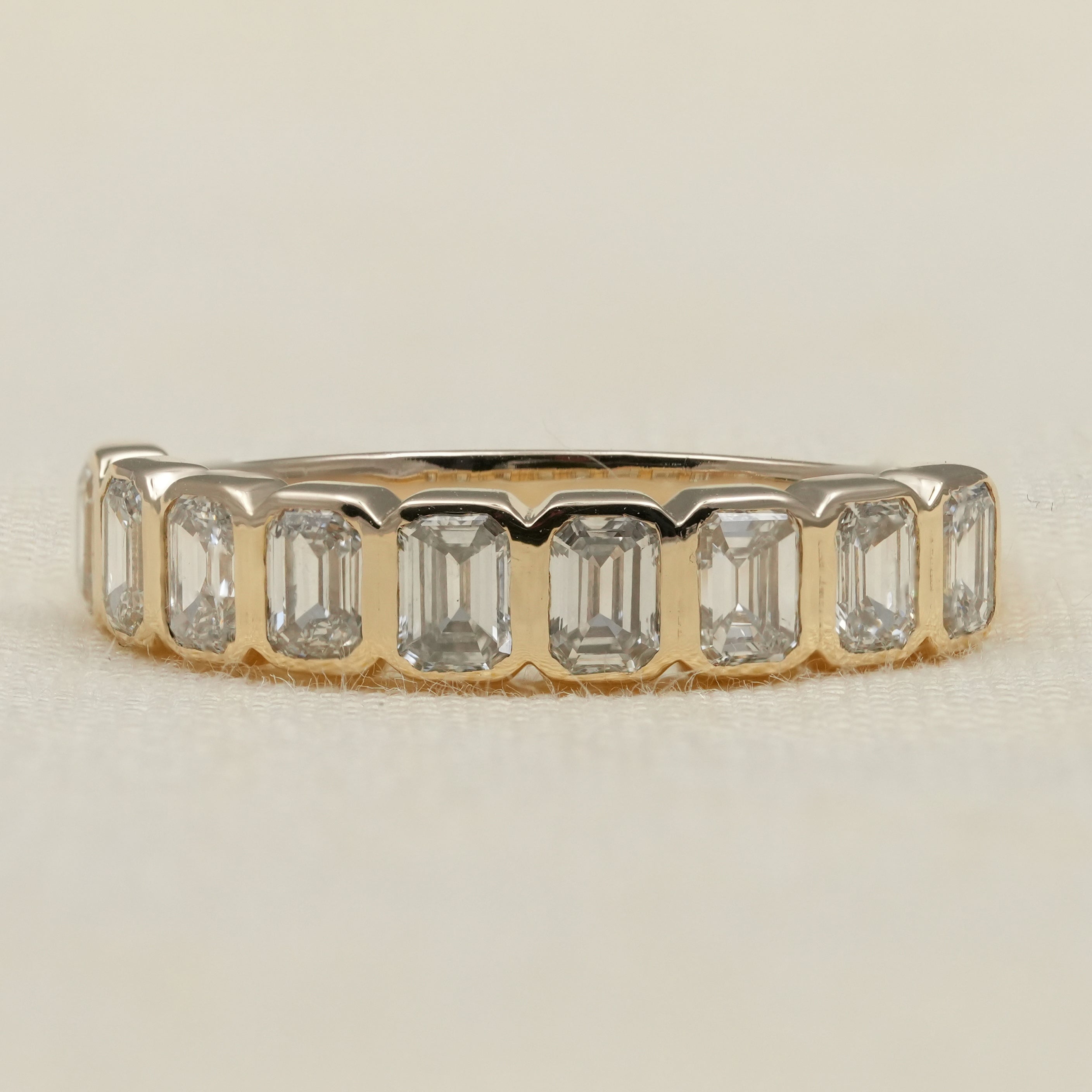 Elegant bezel set emerald cut band featuring lab grown diamonds perfect gift