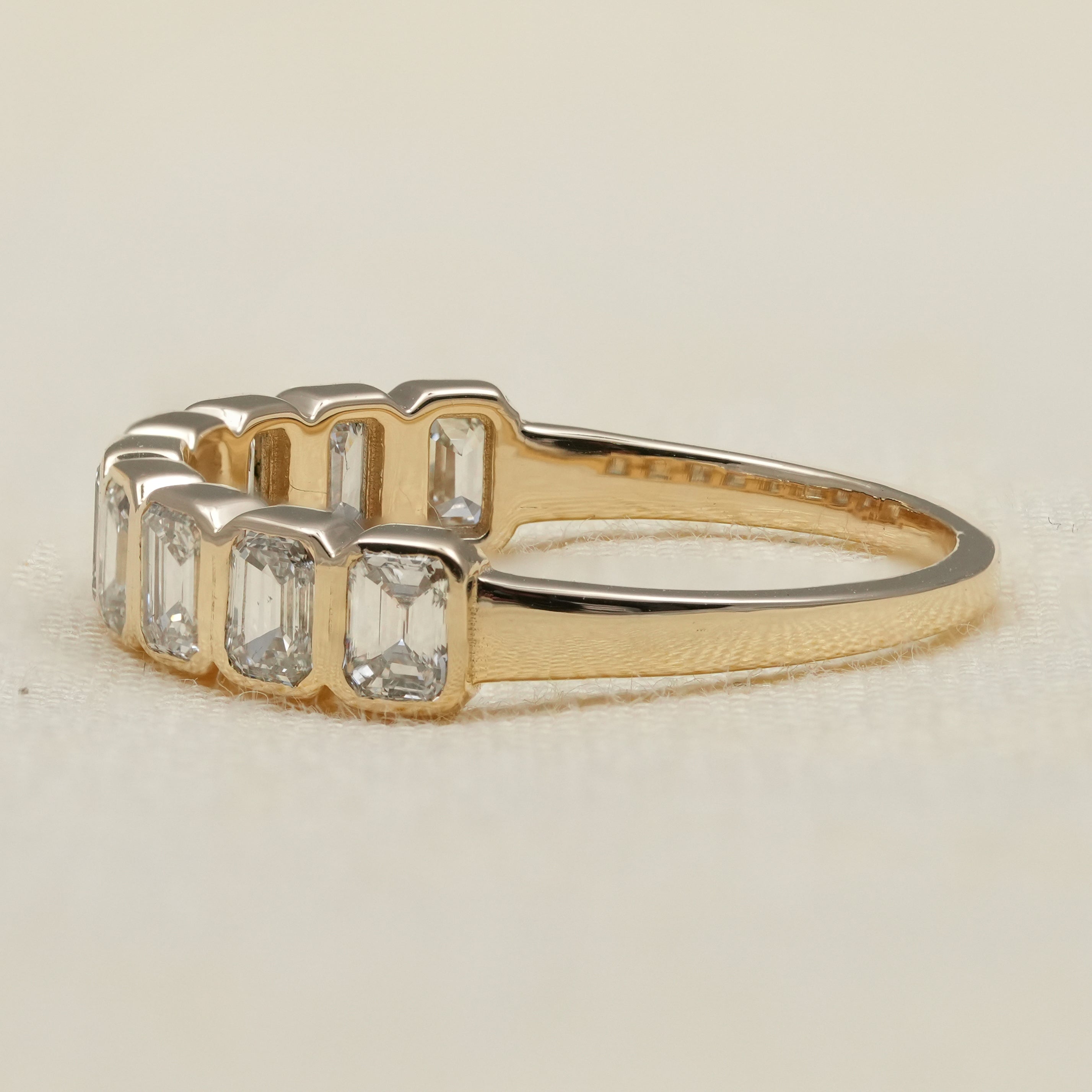 Modern bezel set emerald cut band featuring lab grown diamonds stackable style