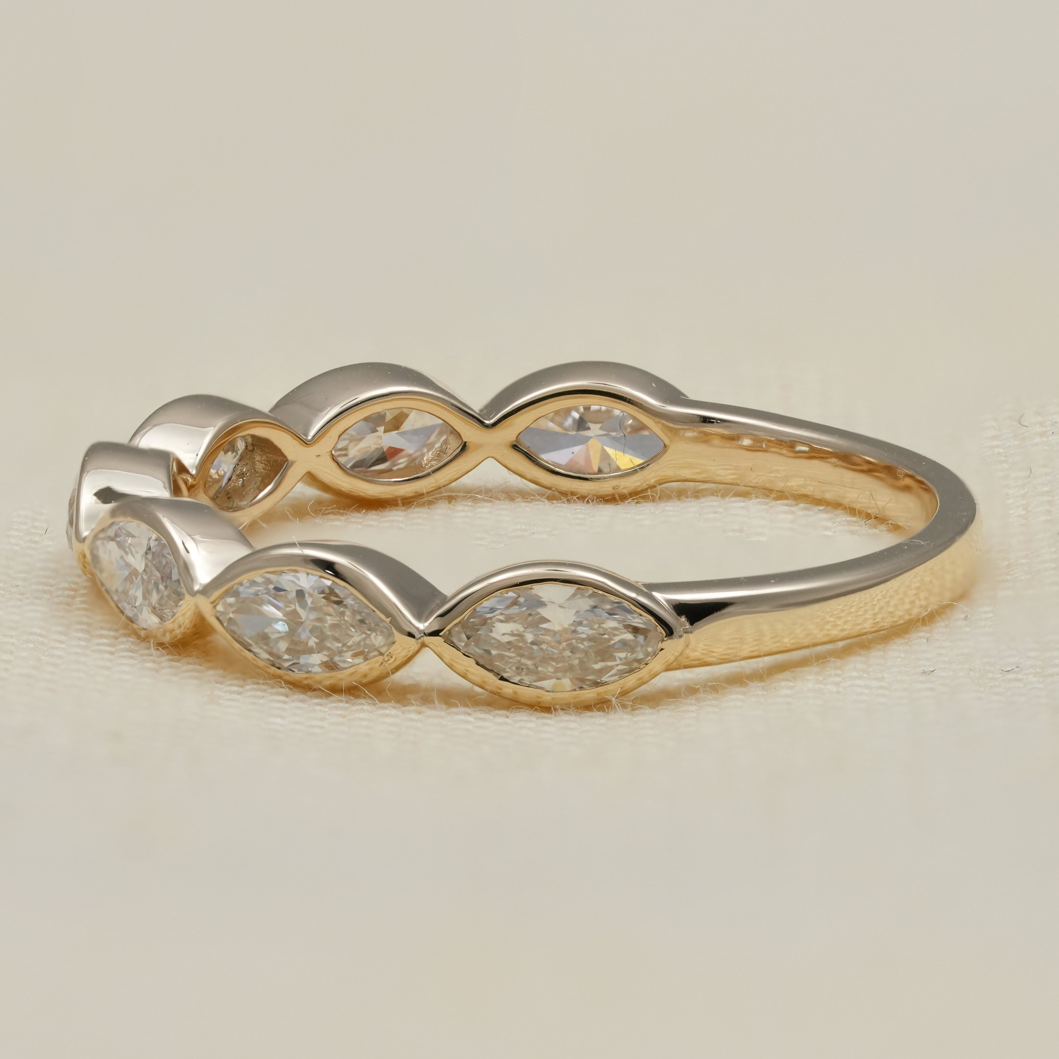 Elegant bezel set marquise diamond band crafted with sparkling lab grown diamonds