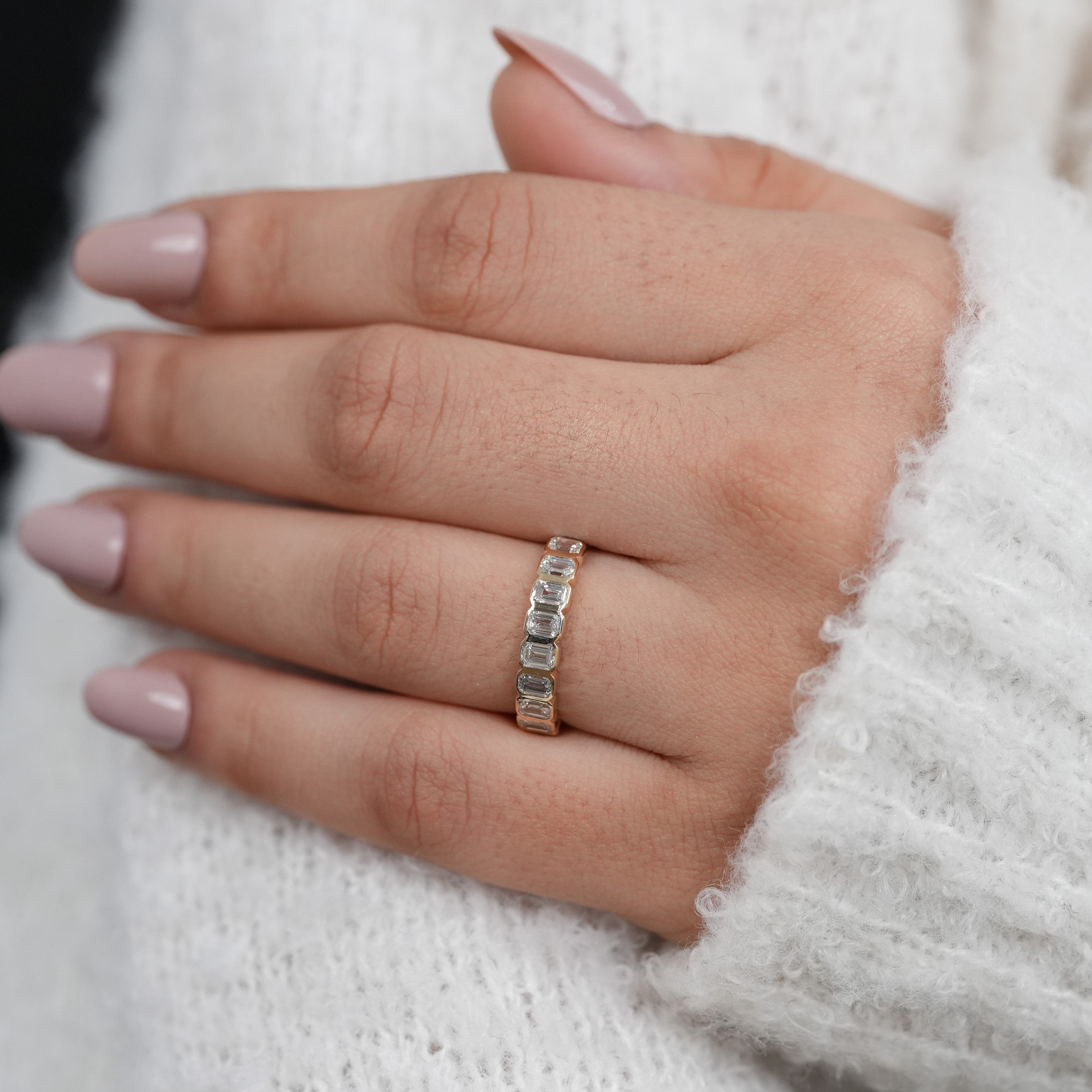 Classic bezel set emerald cut band showcasing lab grown diamond brilliance