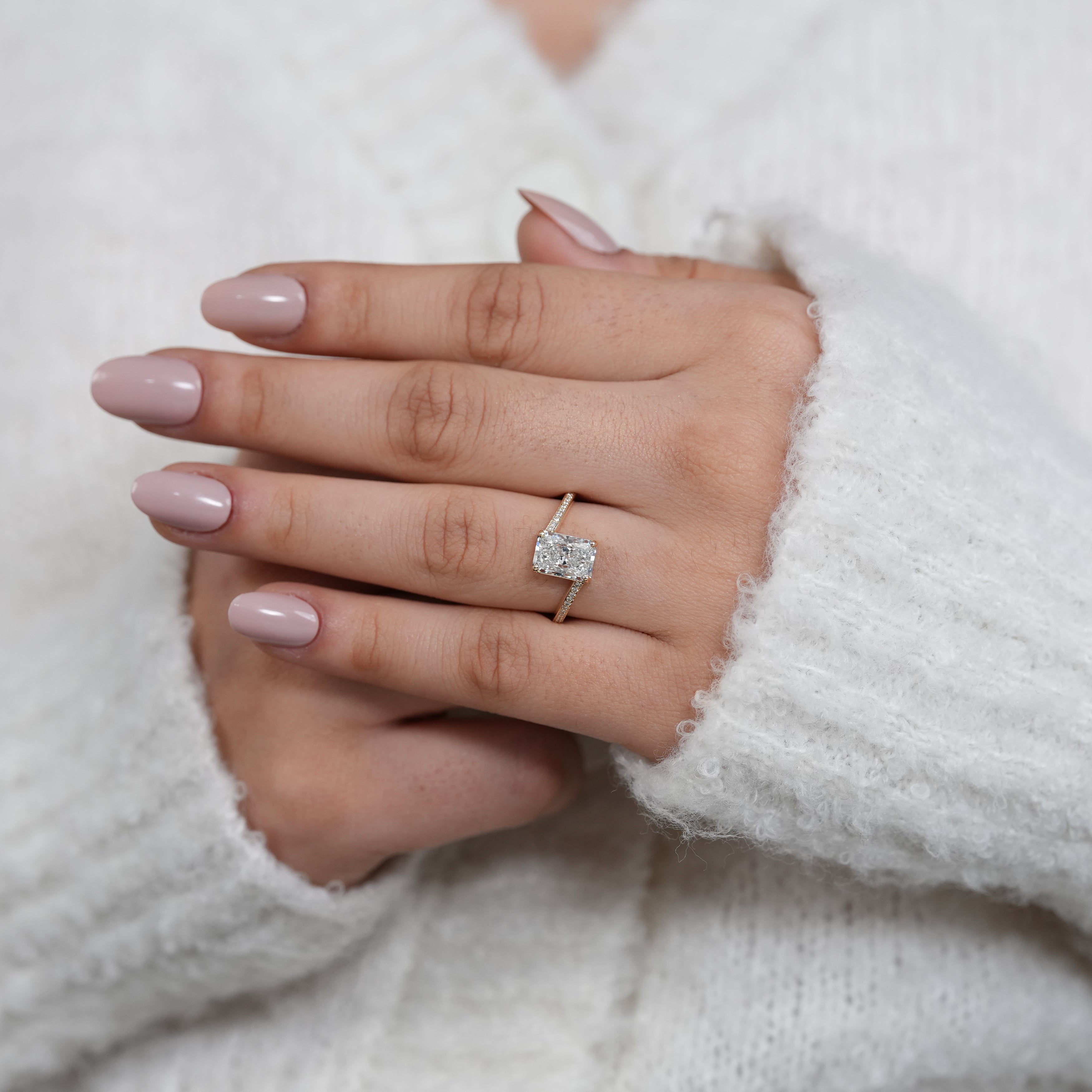 Radiant cut engagement ring with lab grown diamond curved bypass band