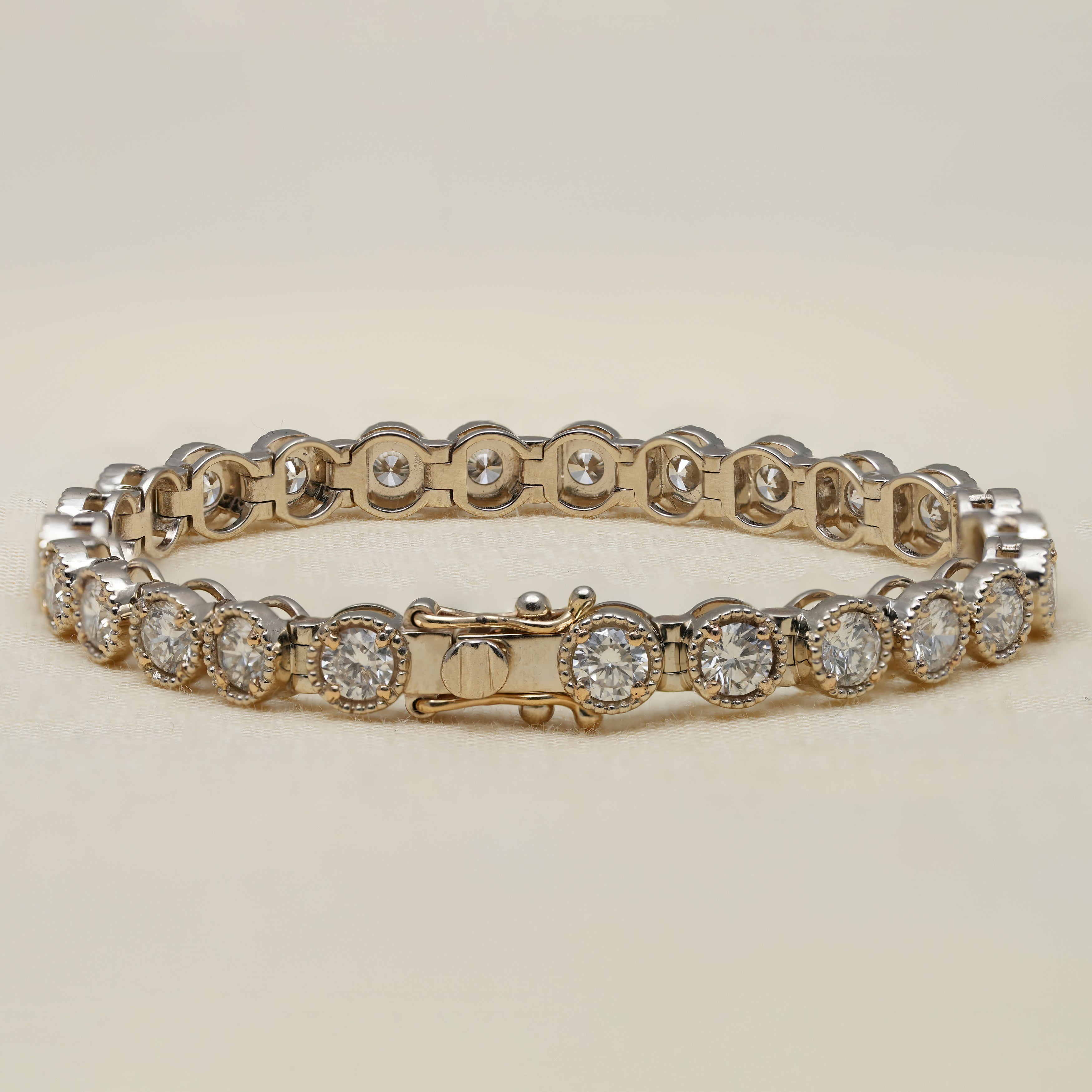 Classic tennis bracelet with round lab grown diamonds and milgrain edges