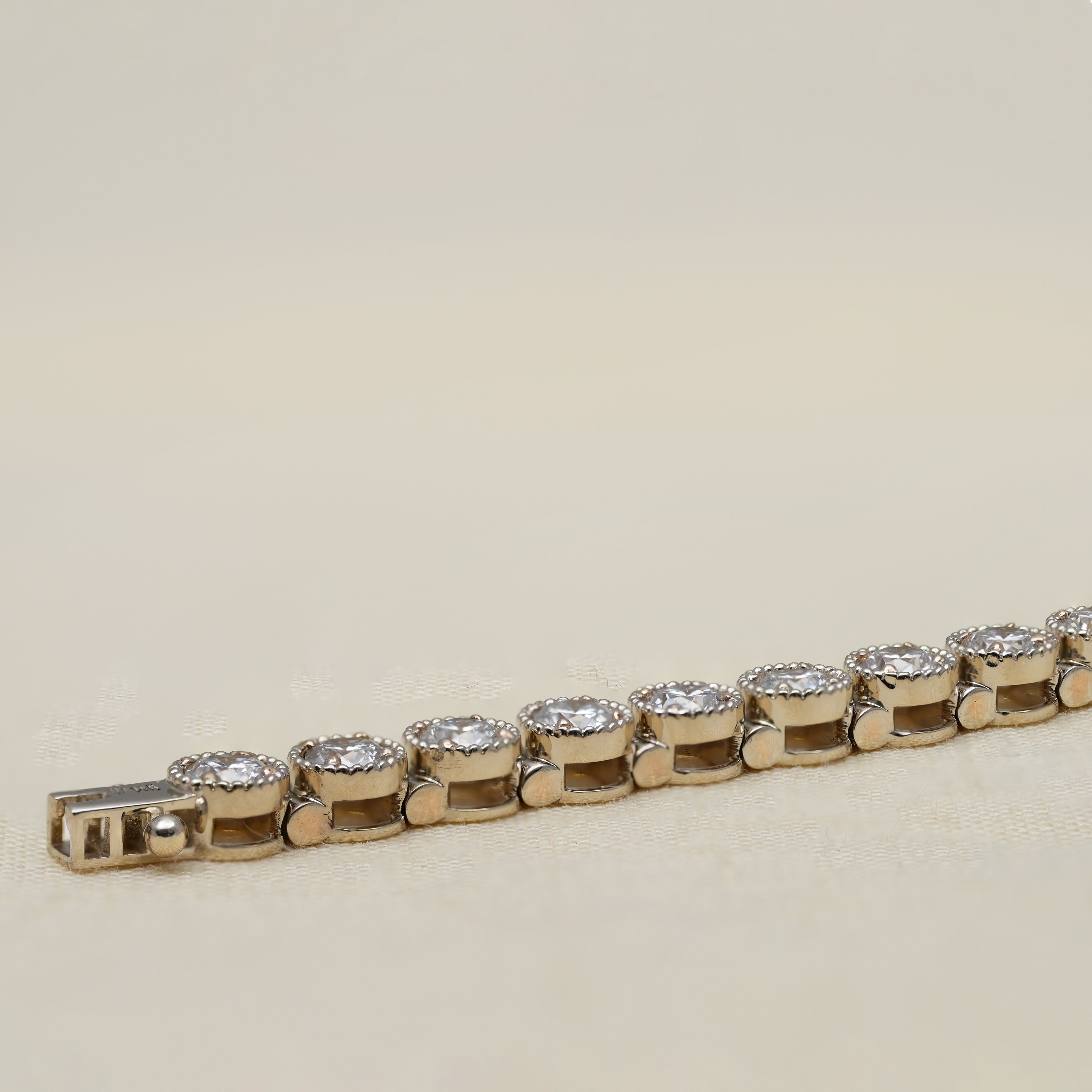Milgrain prong detail on round lab grown diamond tennis bracelet