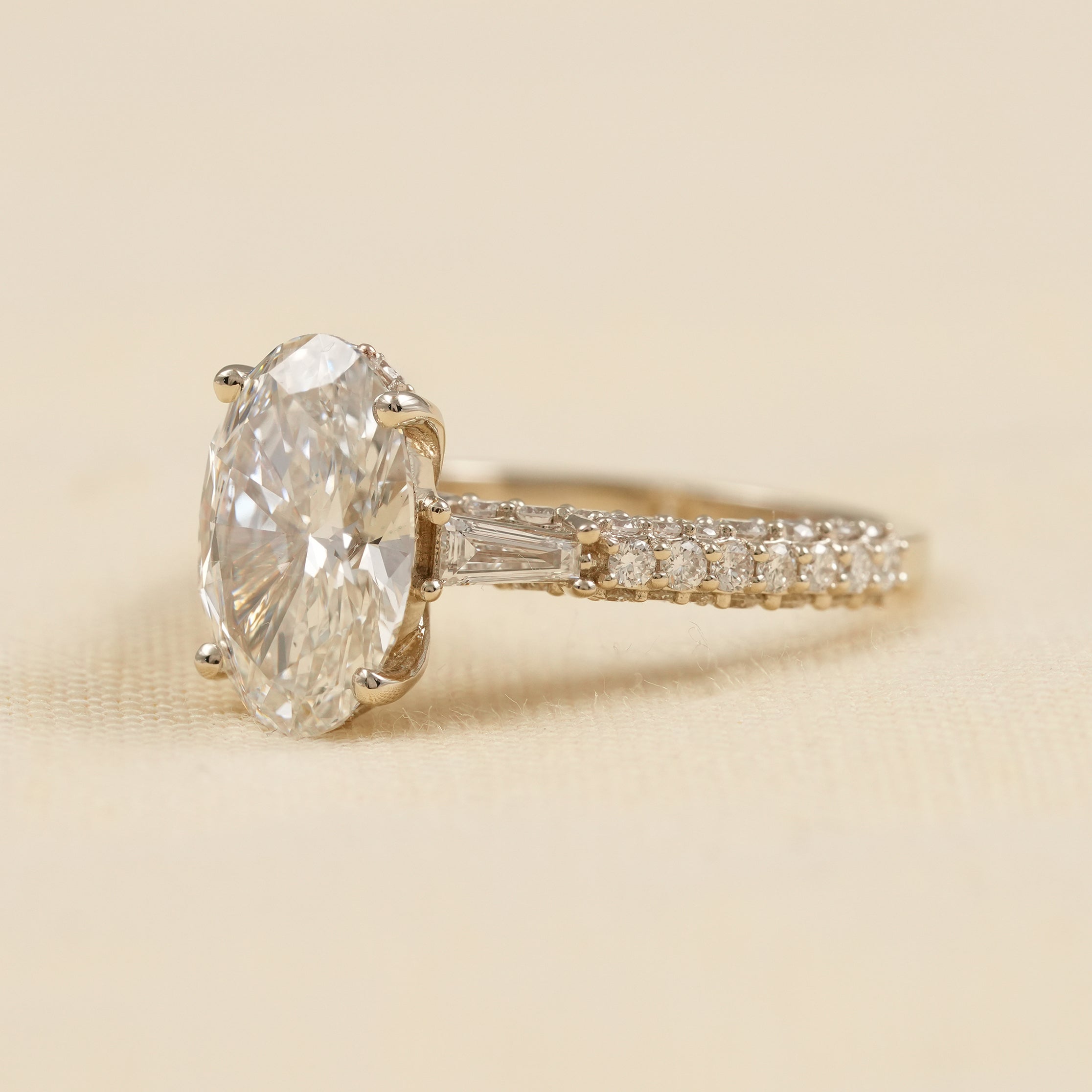 Luxury Oval Diamond Ring with Tapered Baguette and Pave Band