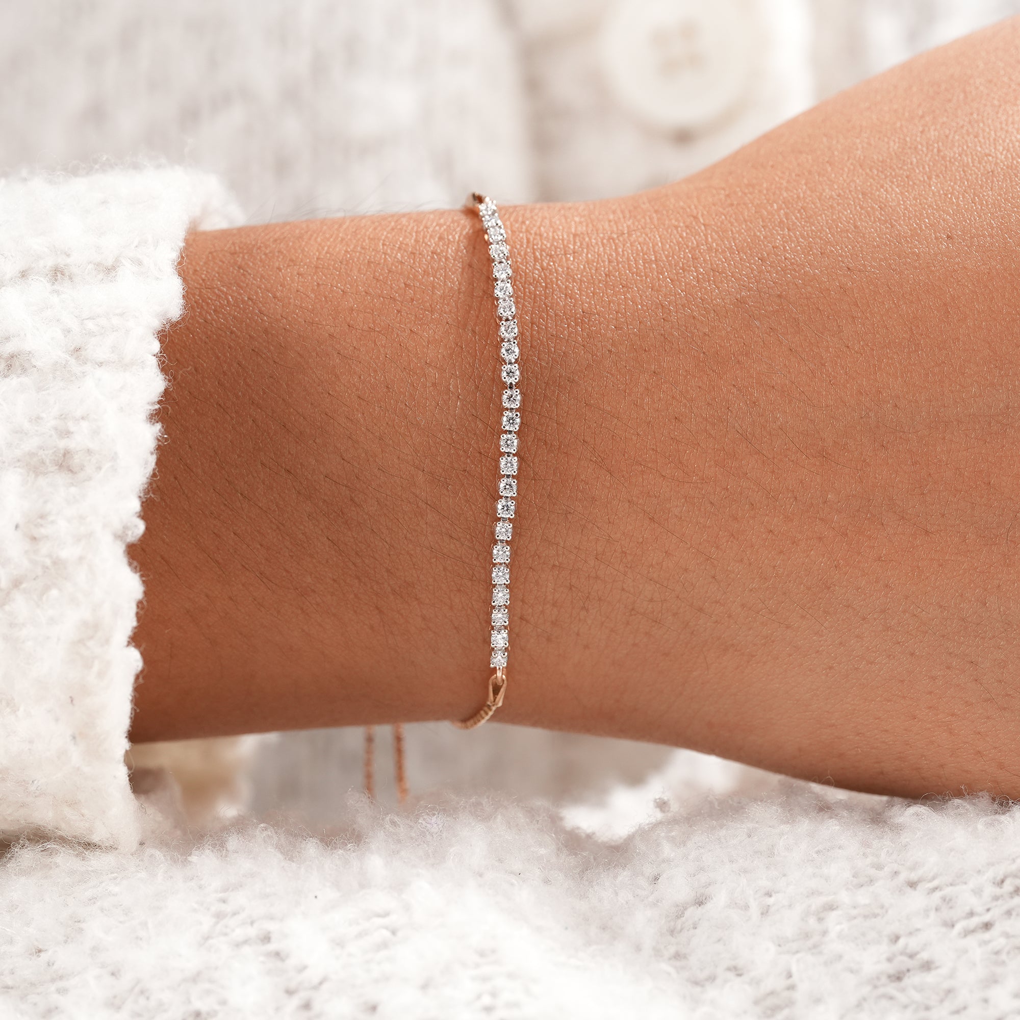 Dainty lab diamond bracelet with sparkling round diamonds and modern sliding bolo clasp.