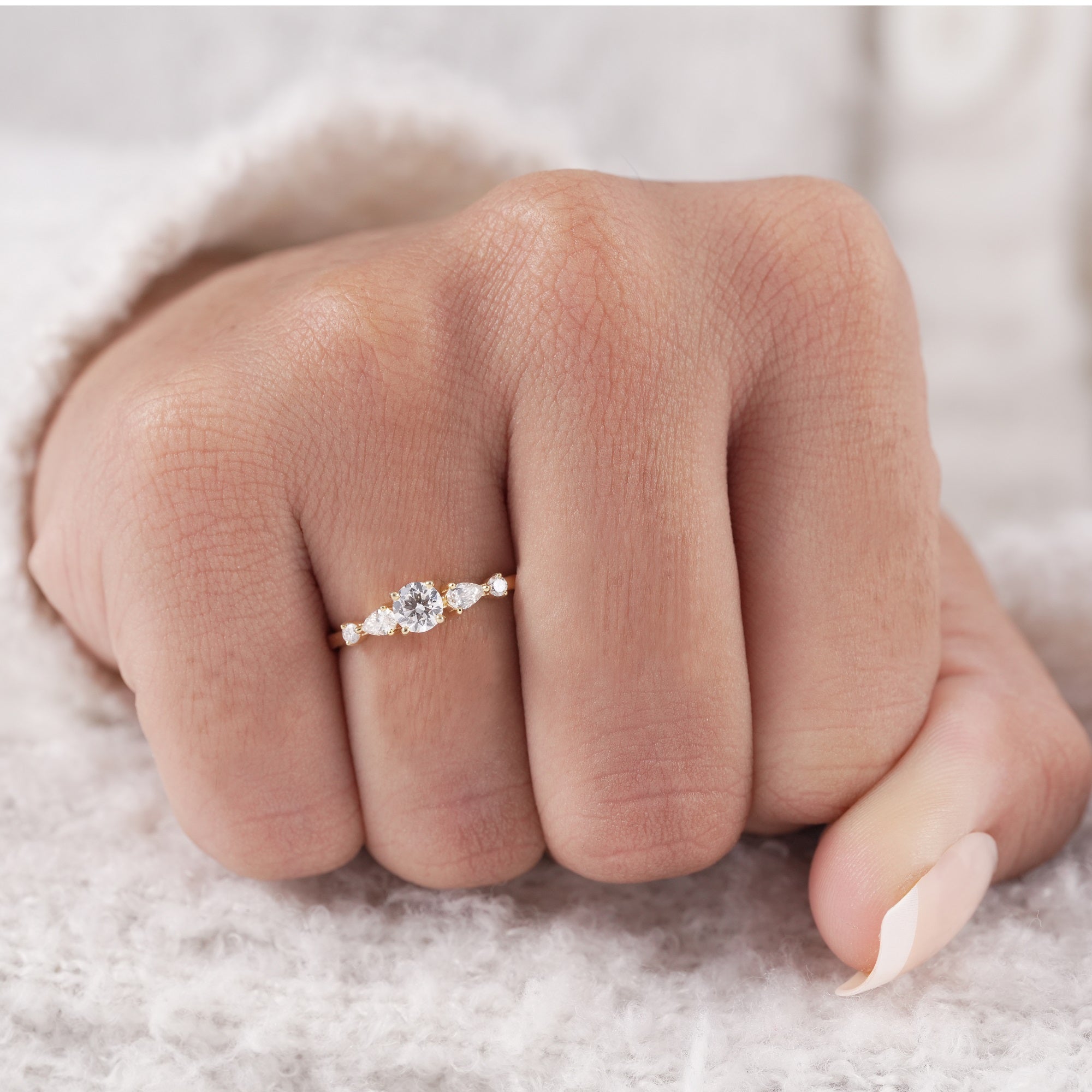 Anniversary ring featuring round and pear lab diamonds