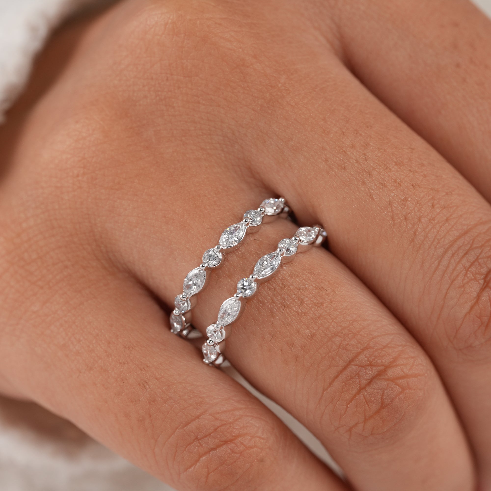 Minimalist marquise and round diamond wedding band.