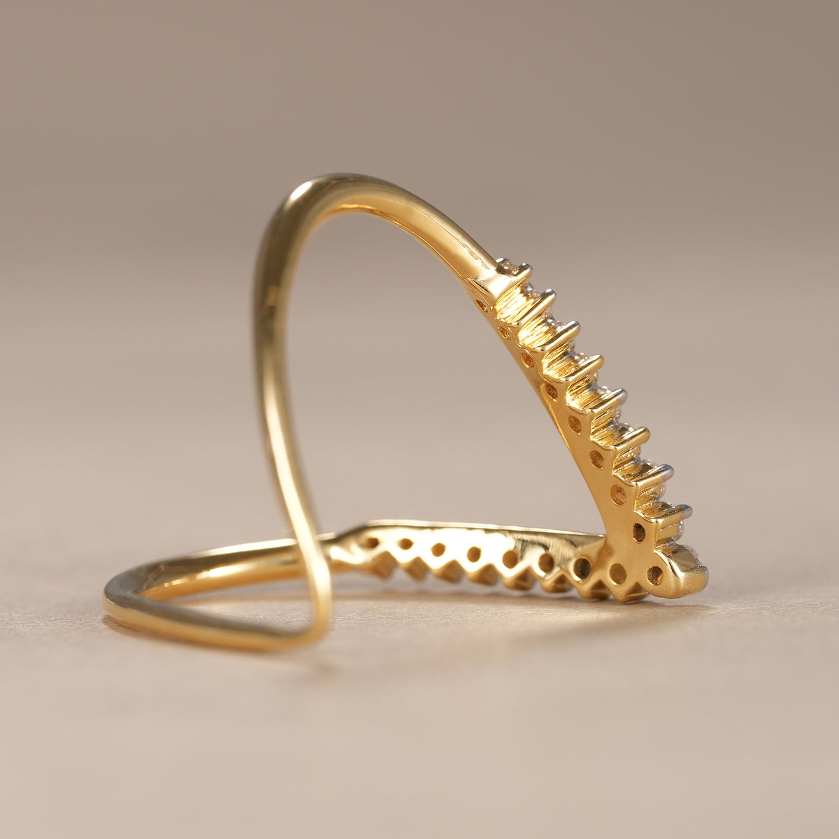 Modern curved bridal band featuring brilliant round lab diamonds and polished gold finish.