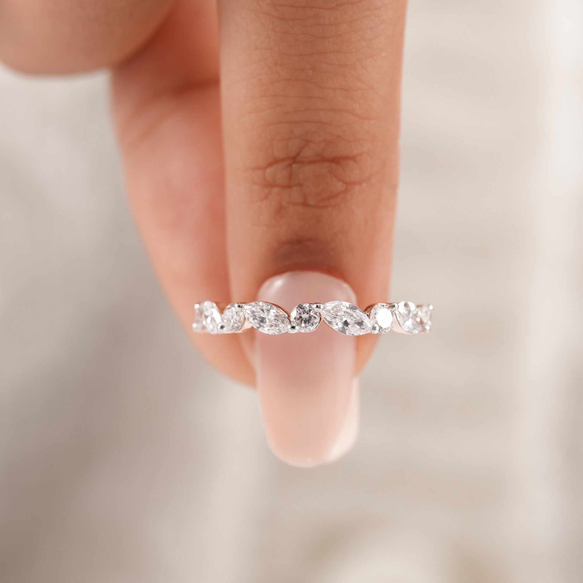 Fine jewelry lab diamond wedding ring with marquise diamonds.
