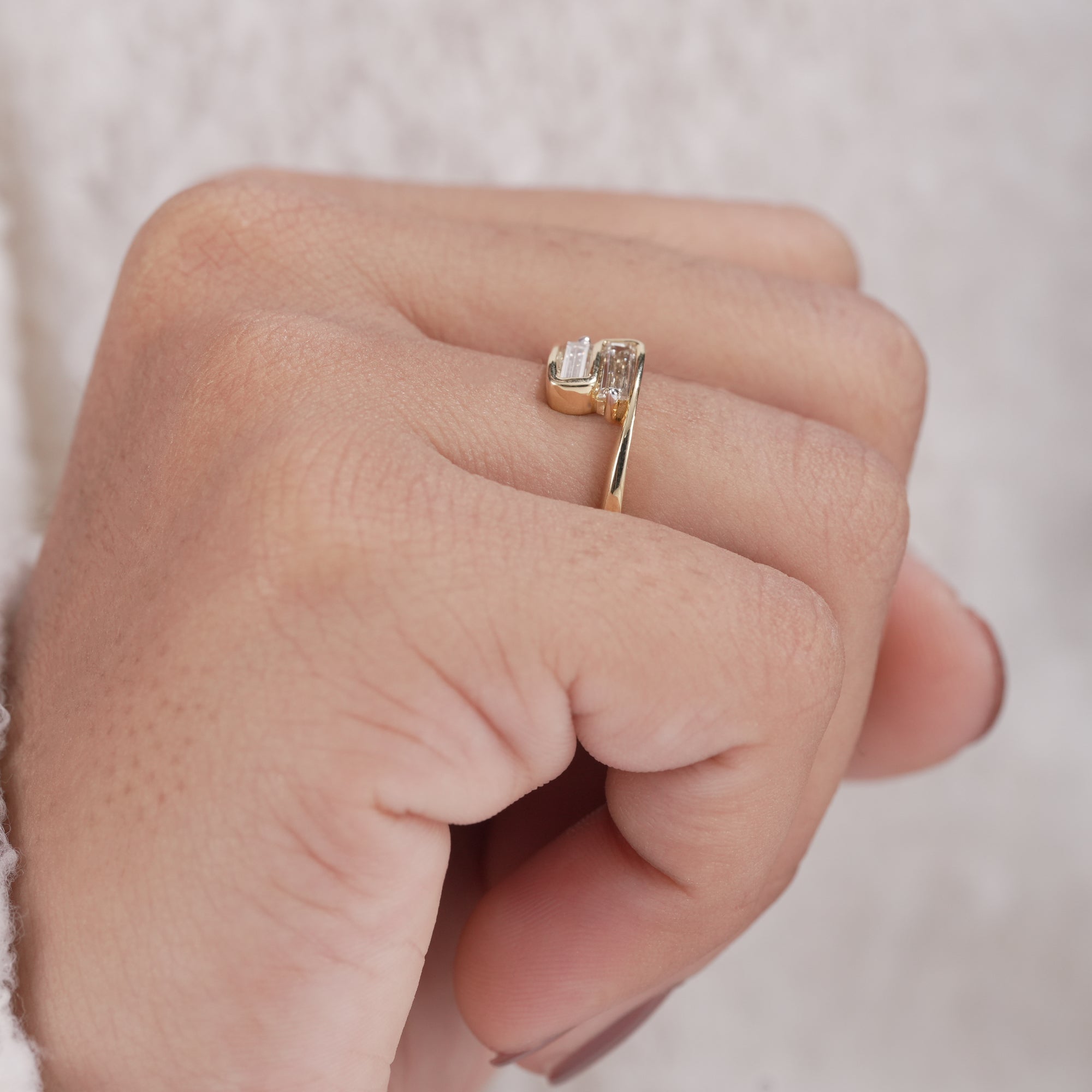 Sleek baguette diamond ring with open crossover band