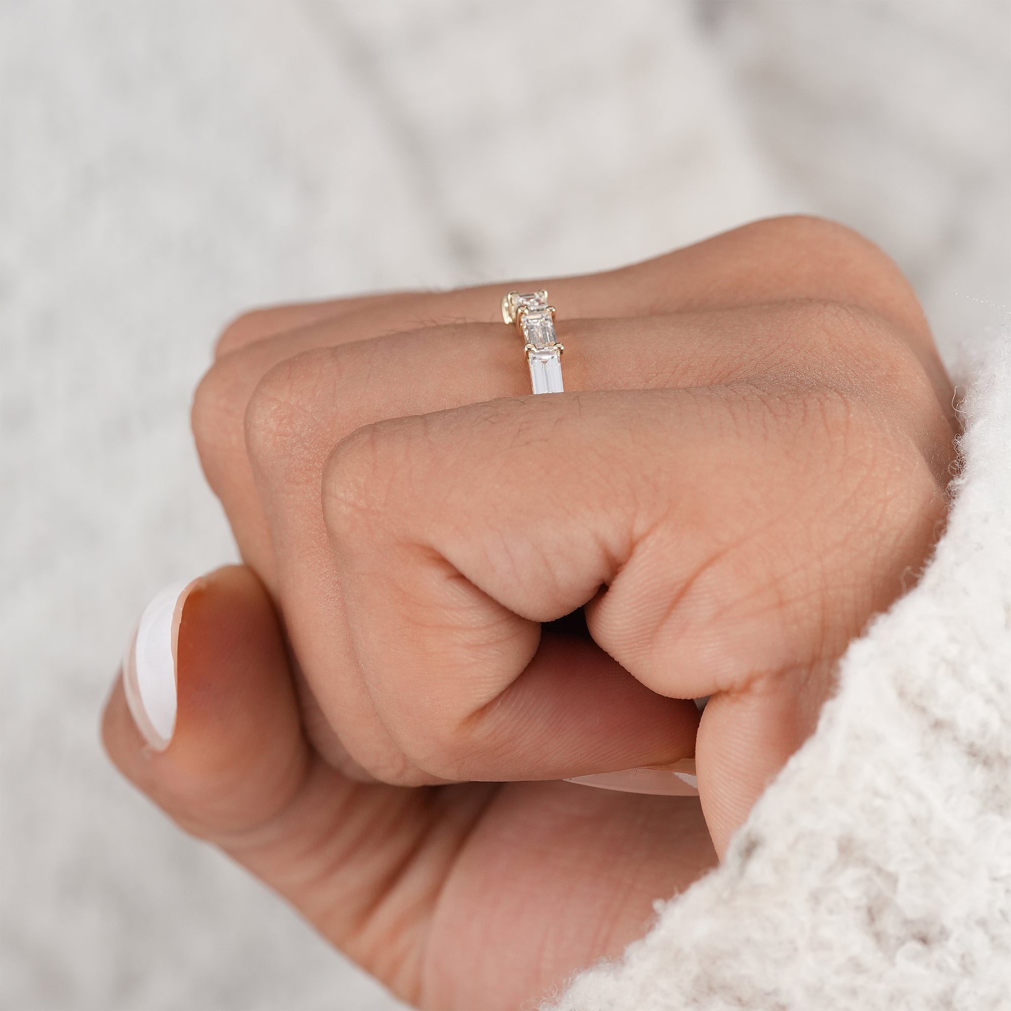 Shared prong baguette diamond eternity band.