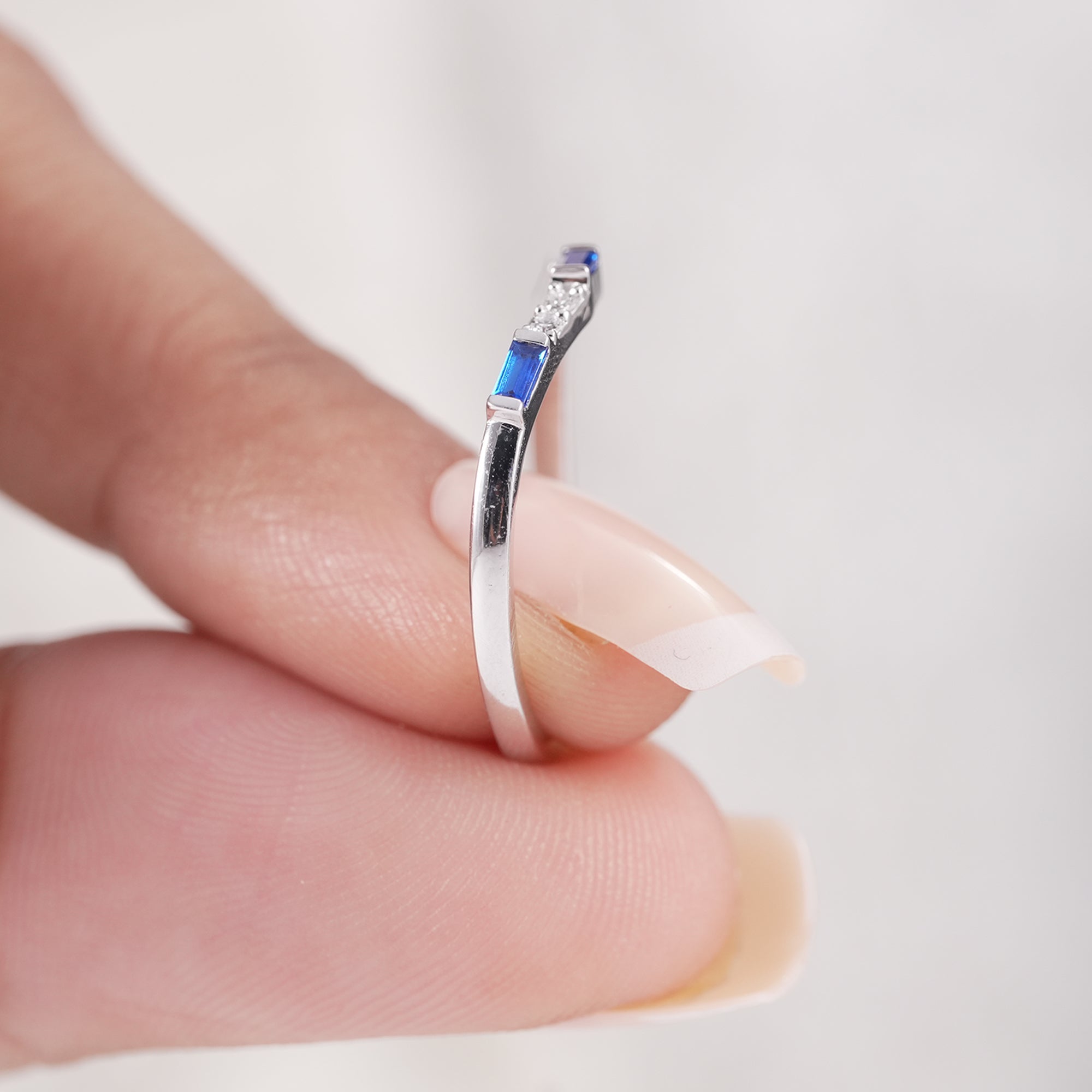 Contoured bridal band with blue baguette diamond details