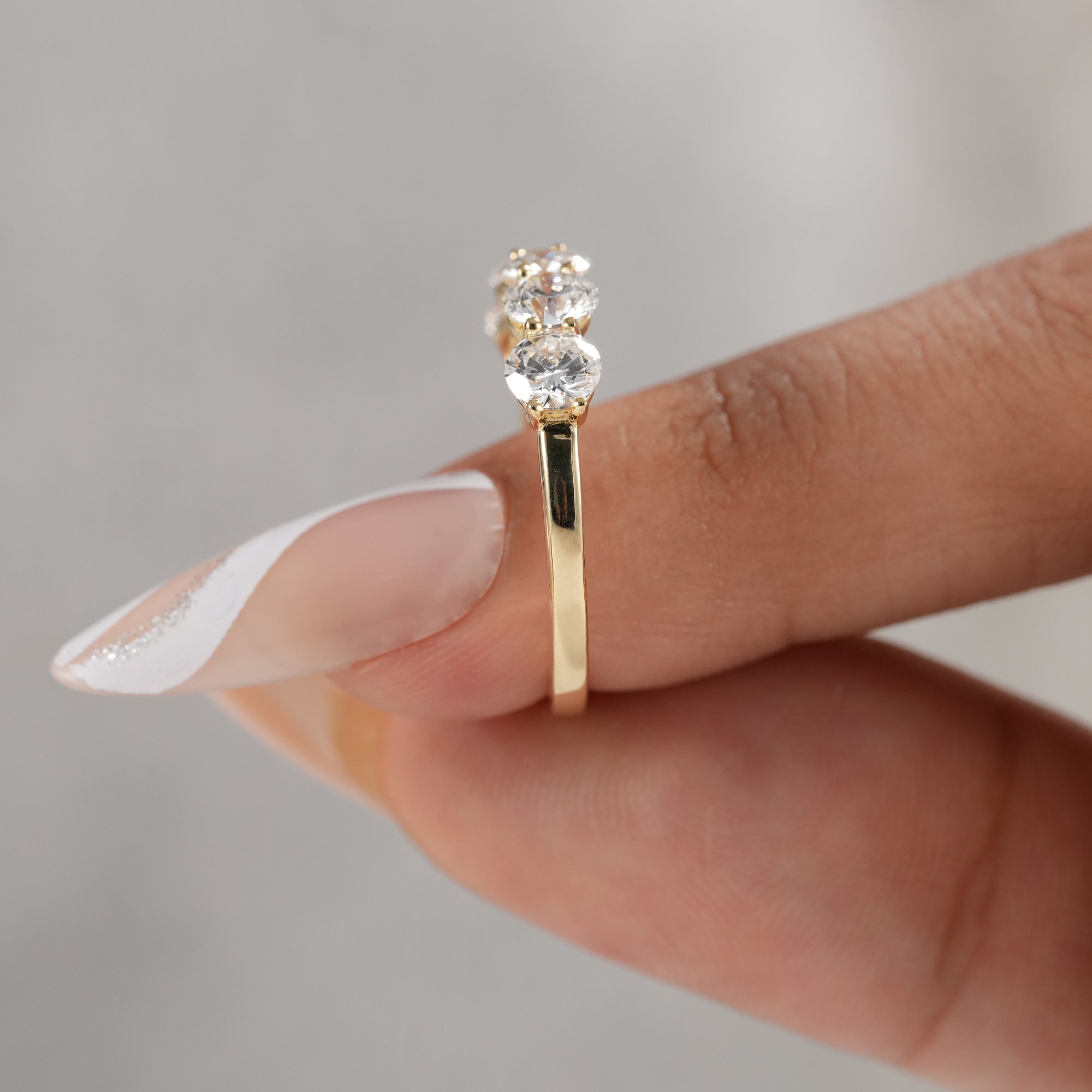 Modern stackable lab diamond wedding band close-up.