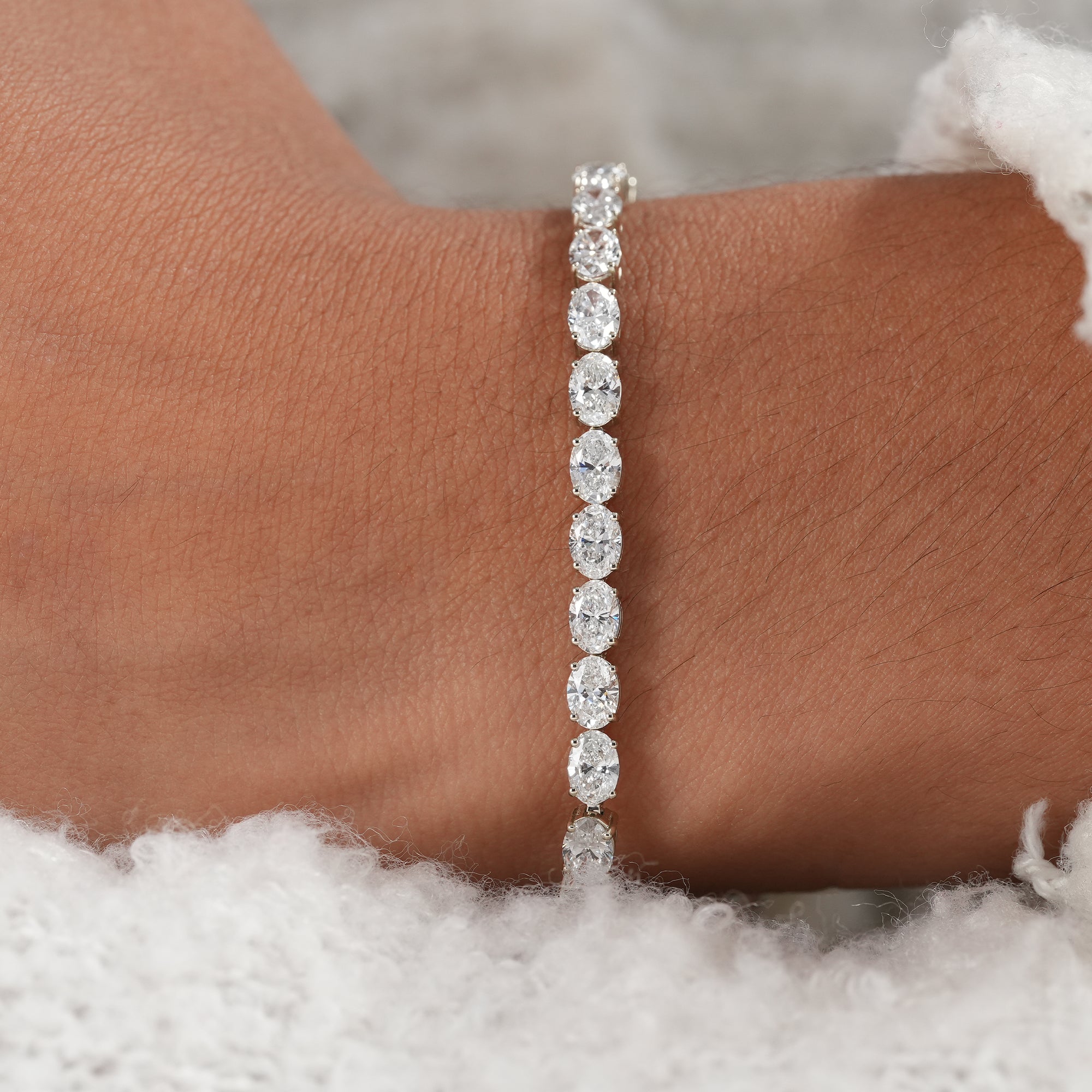 Elegant fine jewelry bracelet featuring oval lab diamonds.