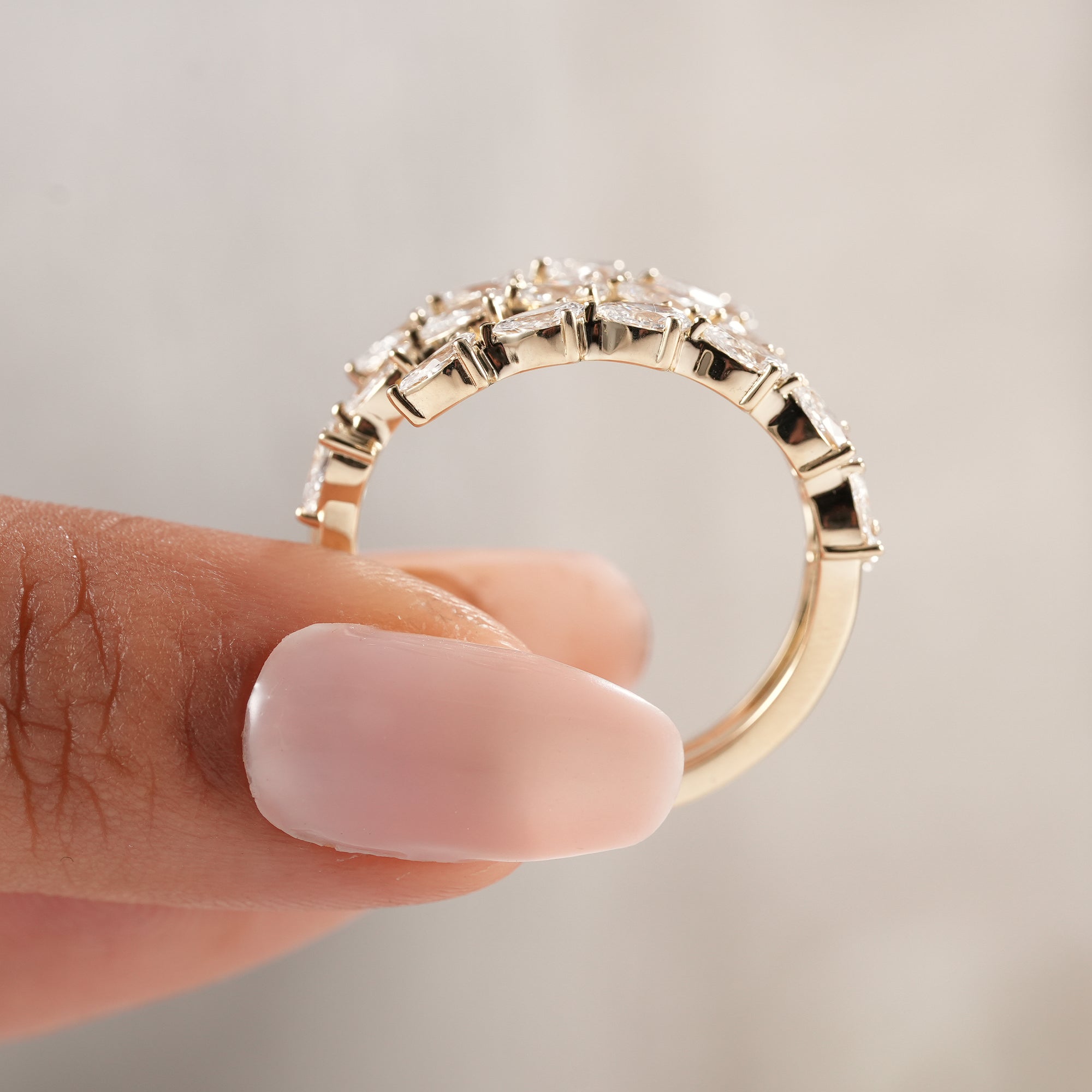 Bridal jewelry featuring three rows of pear lab diamonds.