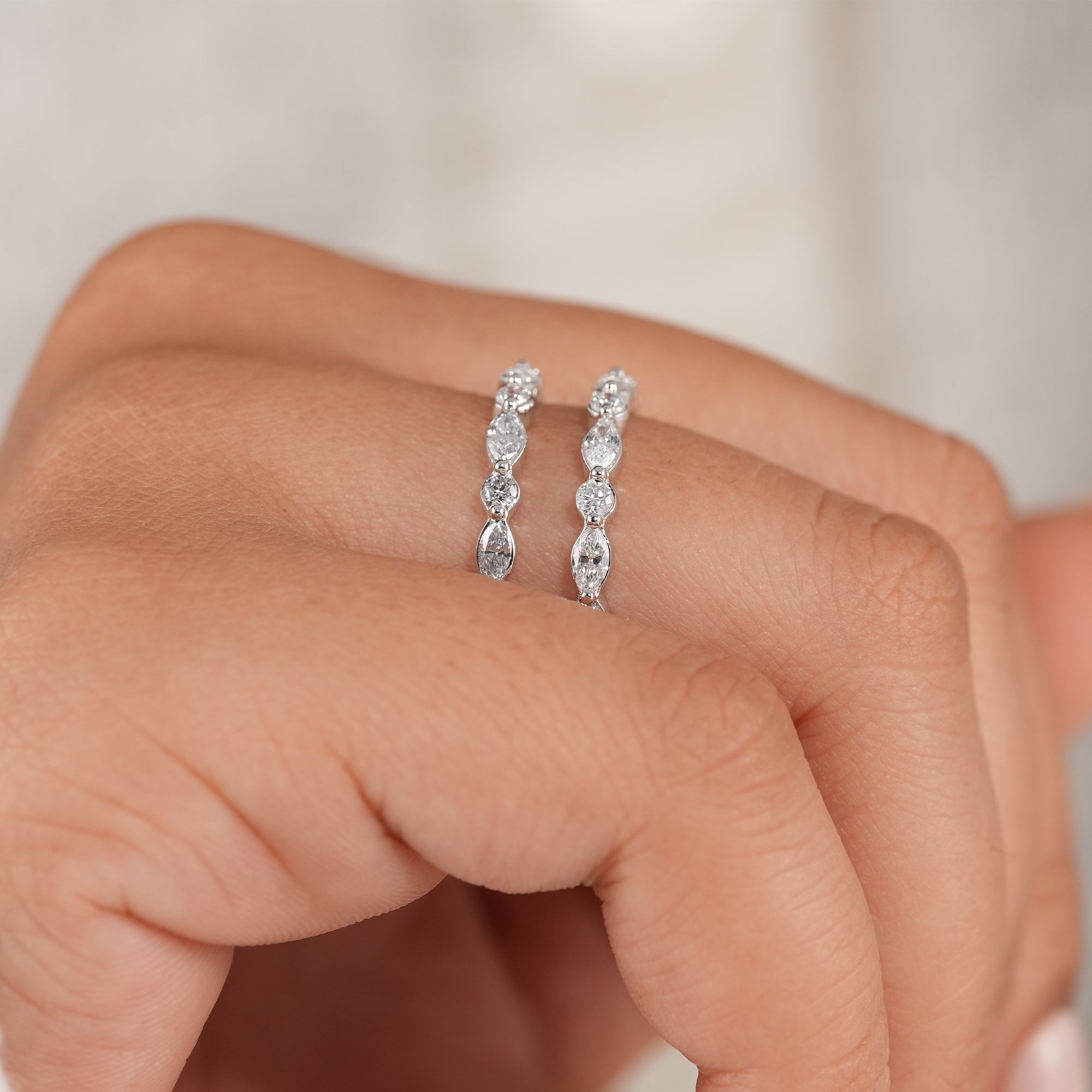 White gold curved diamond band for engagement ring stacking.