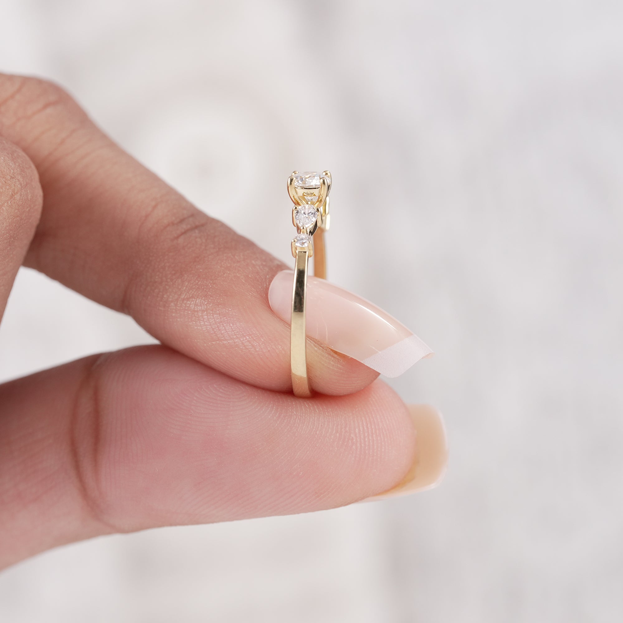 Modern bridal ring with round center and side diamonds