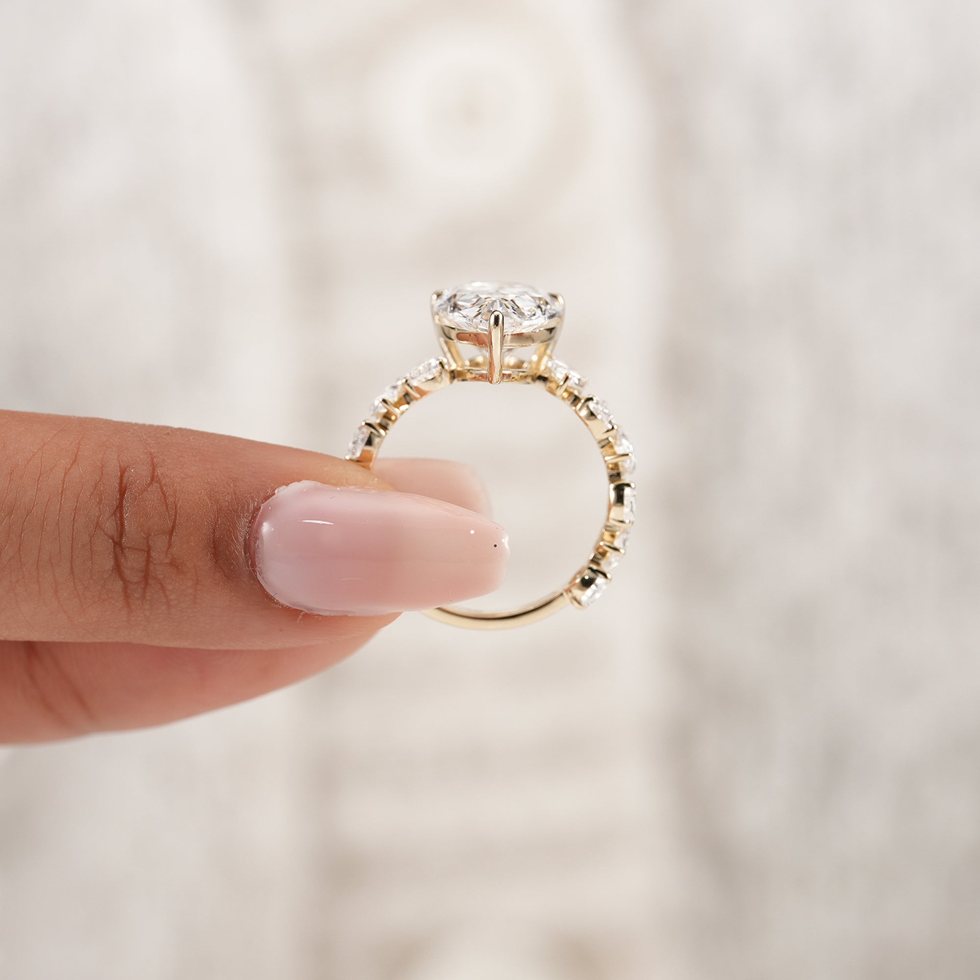 Pear bridal engagement ring with marquise and pear accents