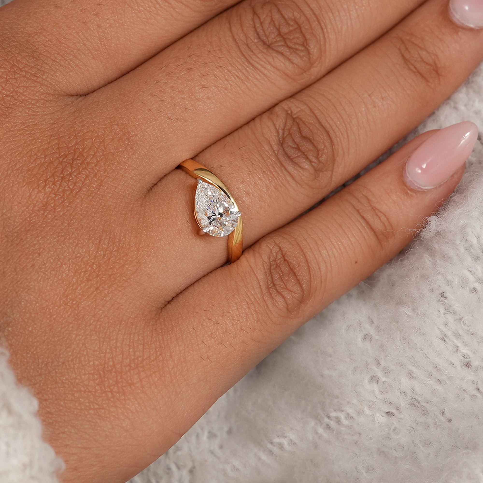 Sustainable pear lab diamond wave engagement ring