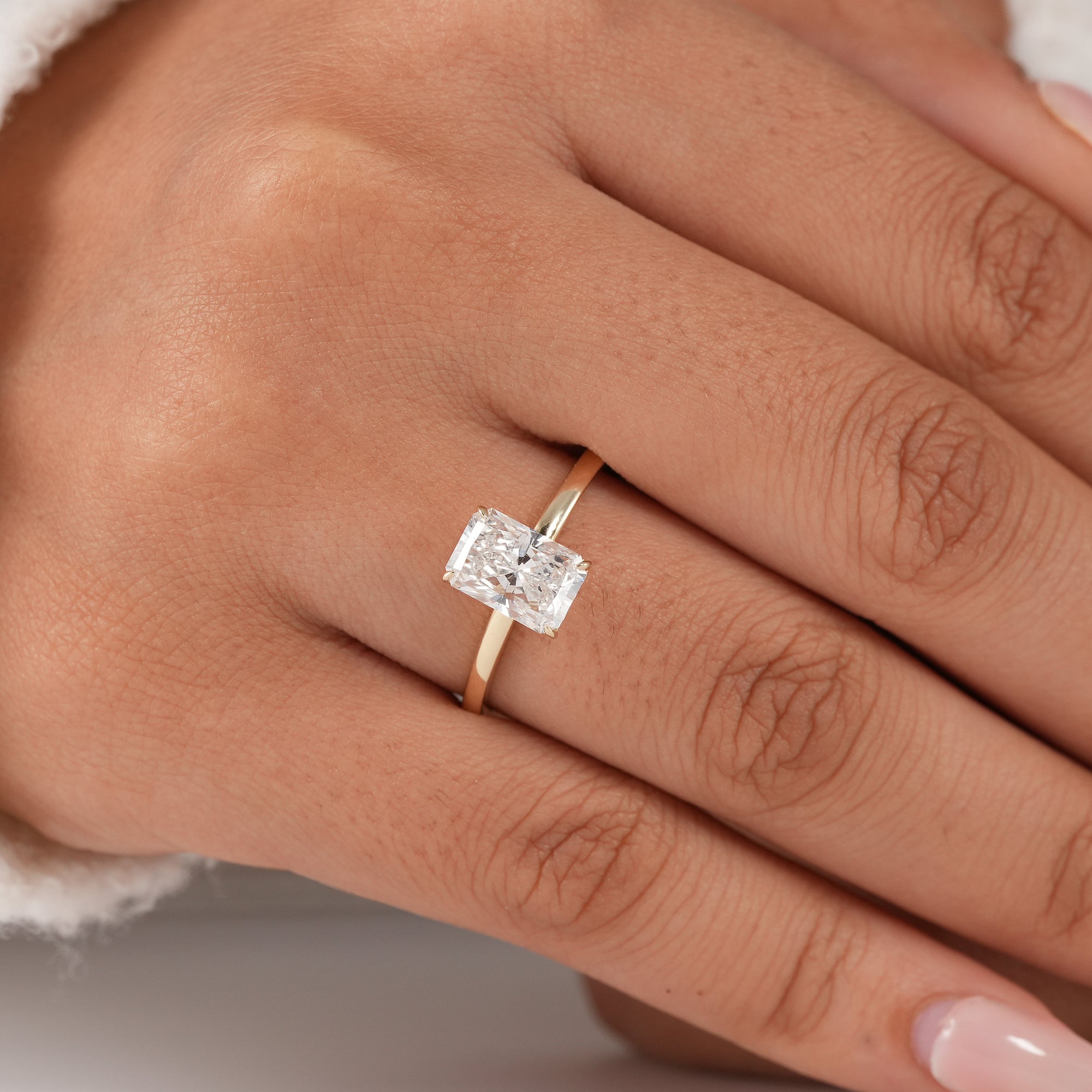 Modern radiant solitaire ring handcrafted in solid gold.
