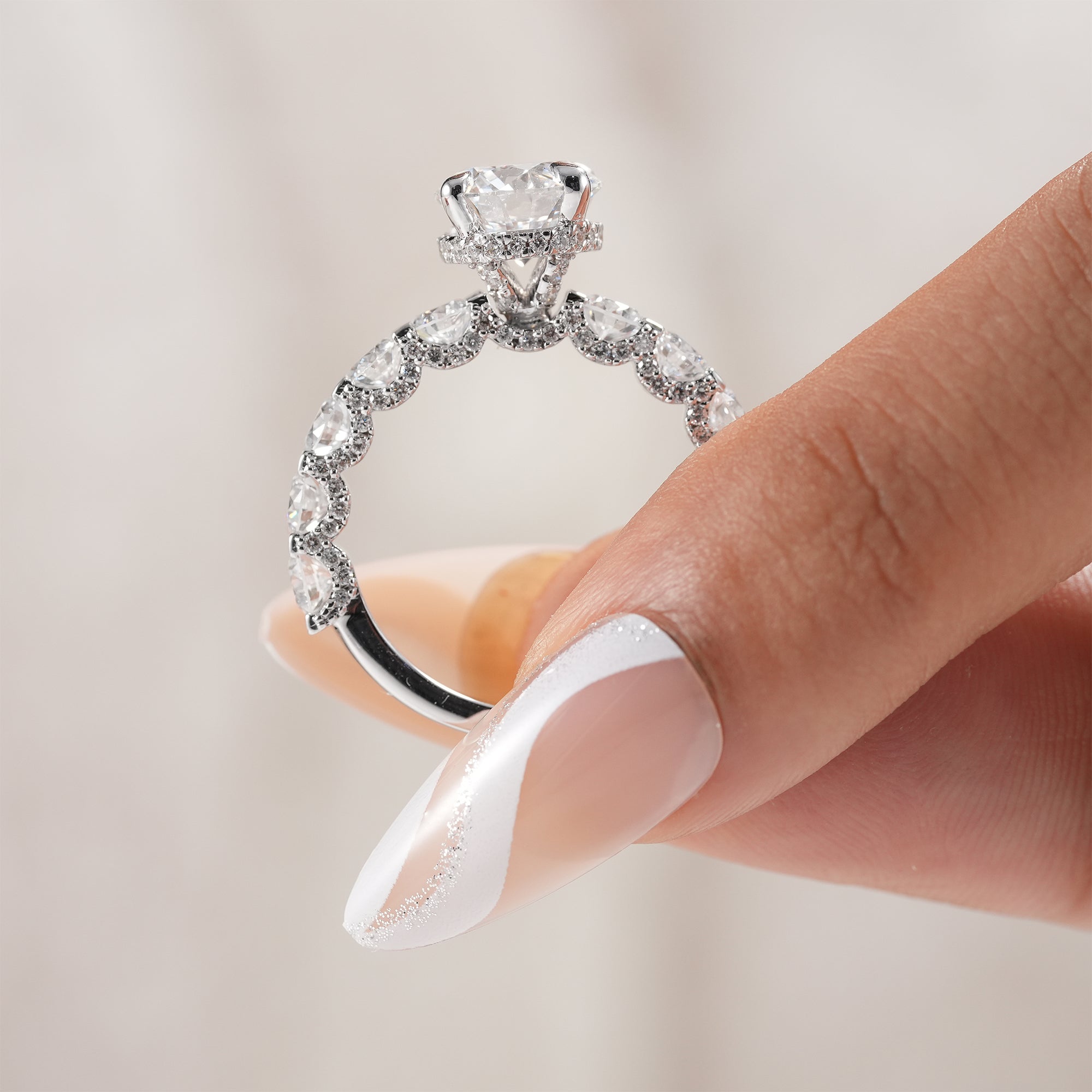 Modern round engagement ring with hidden halo setting.