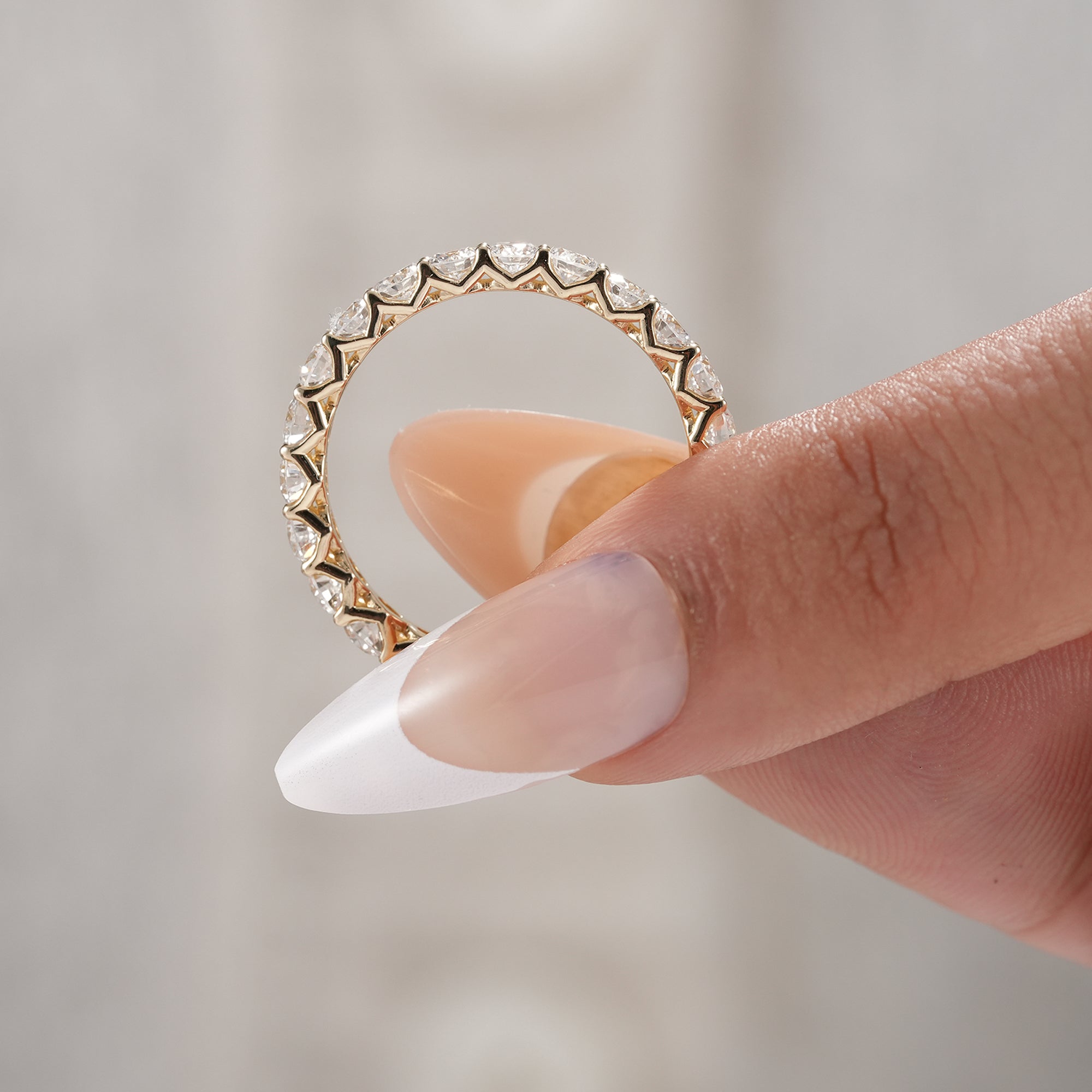 Gold round diamond eternity ring for everyday luxury.