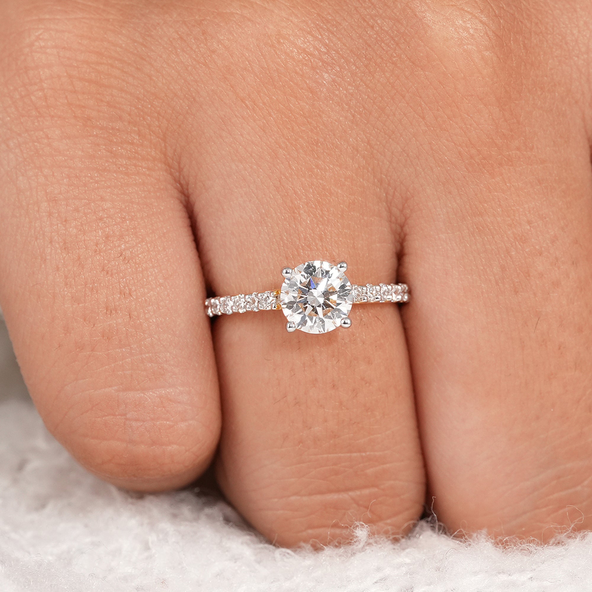 Fine jewelry round engagement ring with delicate pavé band