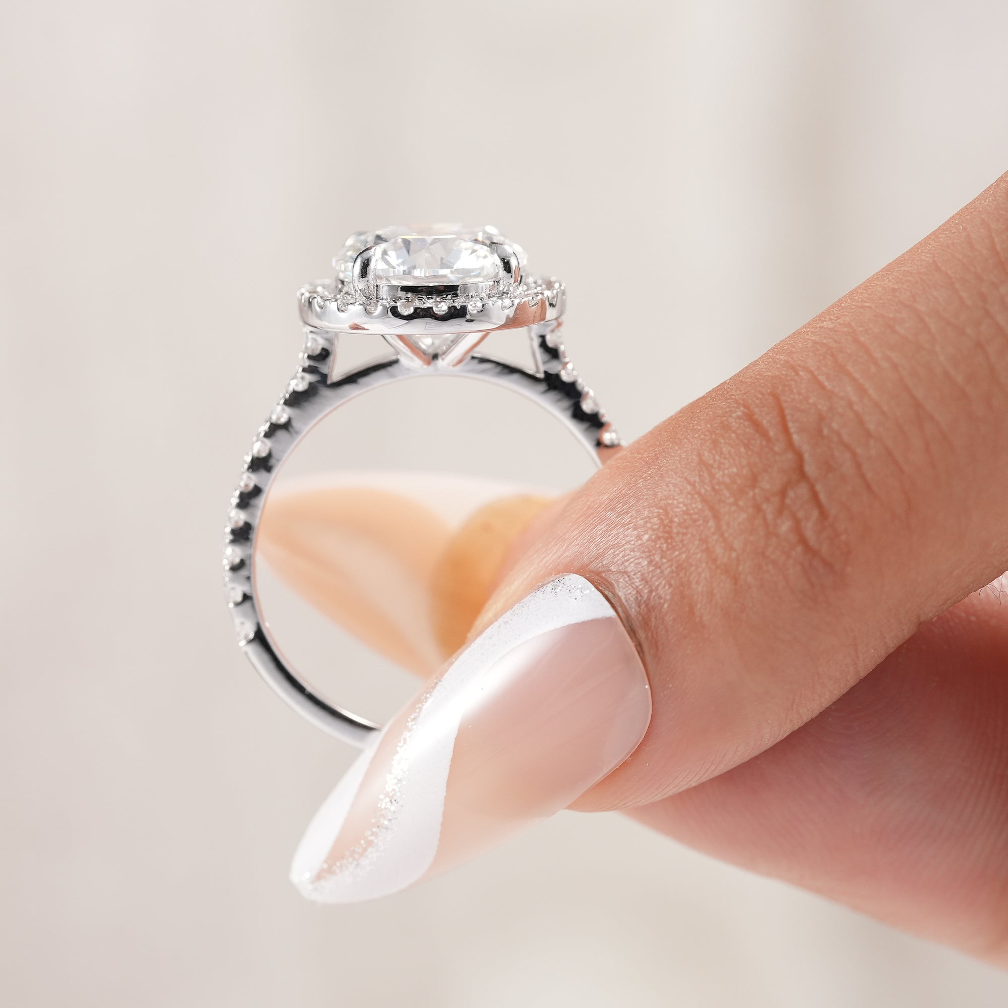 Handmade round diamond engagement ring with polished finish.