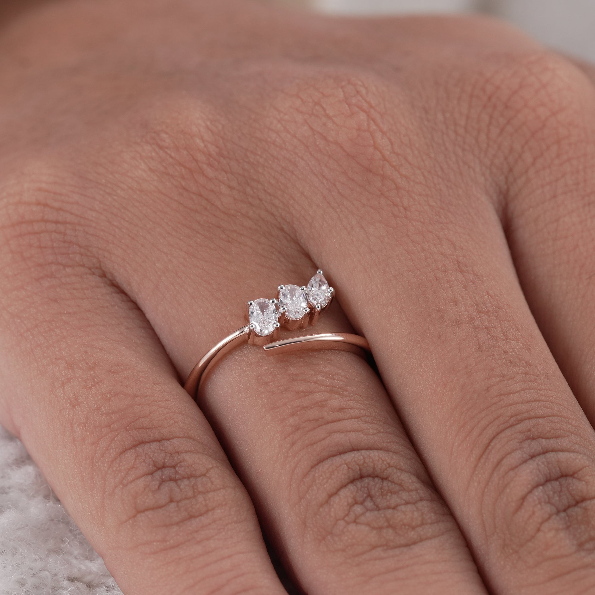 Contemporary open wedding ring with three stones