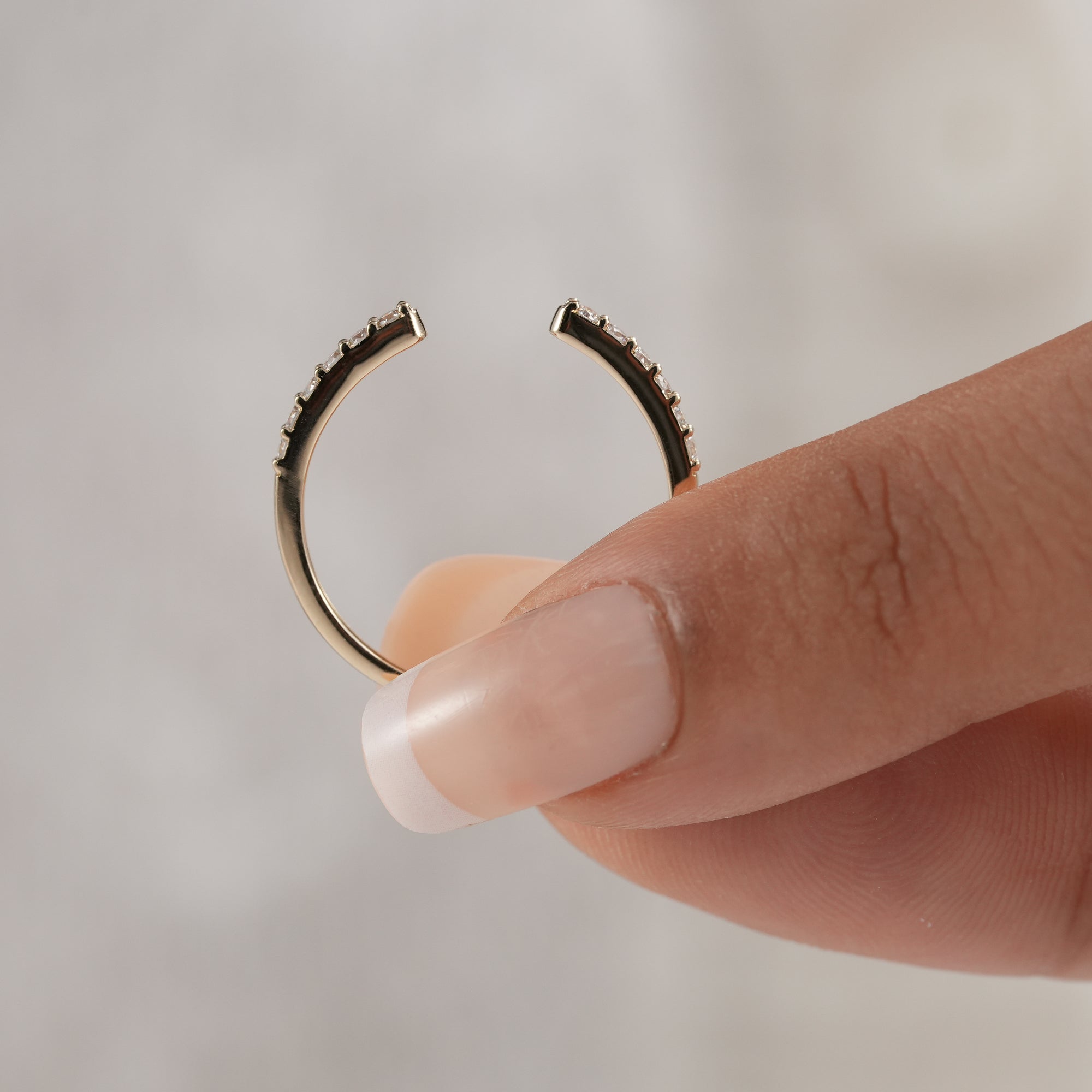 Two-tone open wedding band with round lab diamonds