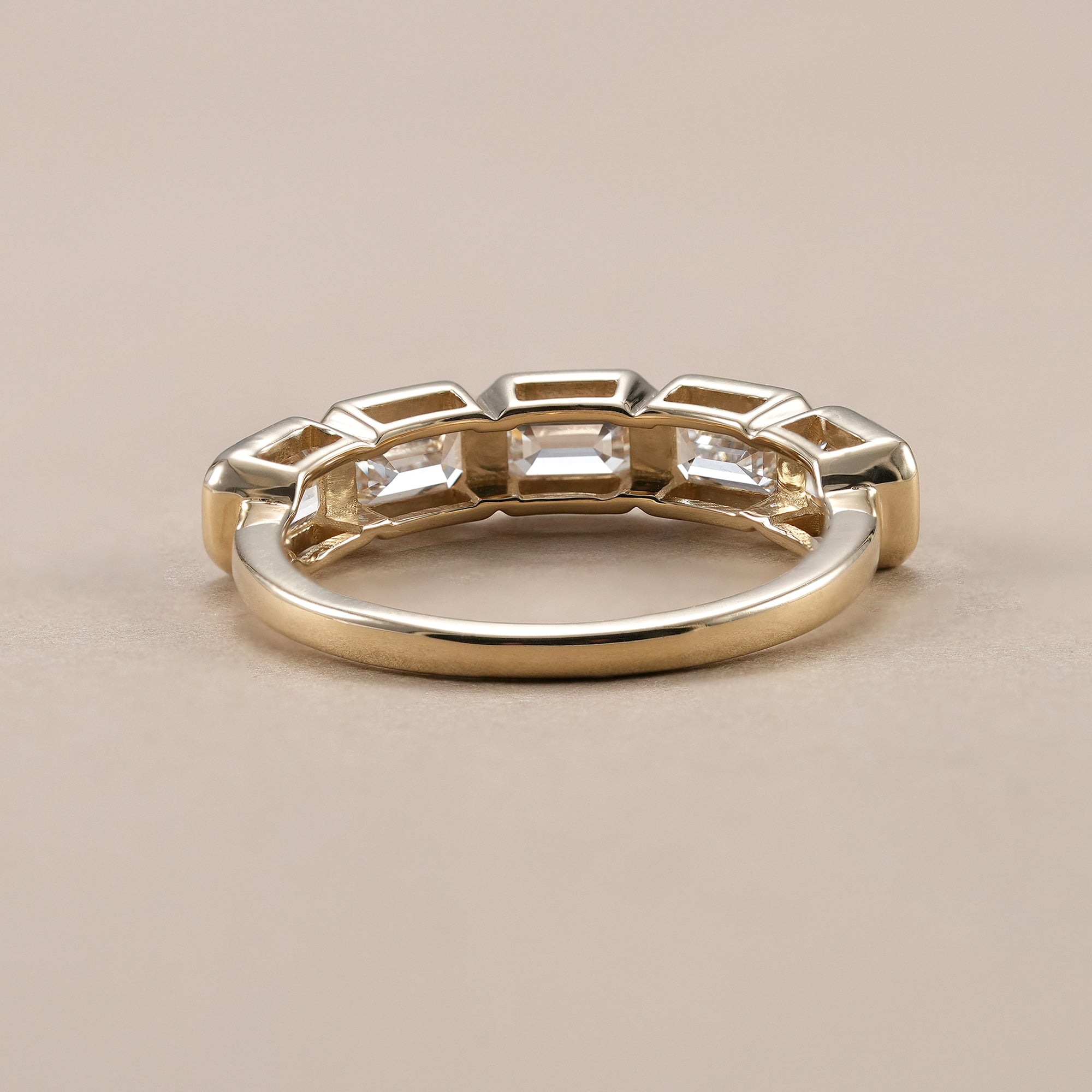 Elegant emerald cut lab diamond anniversary ring.