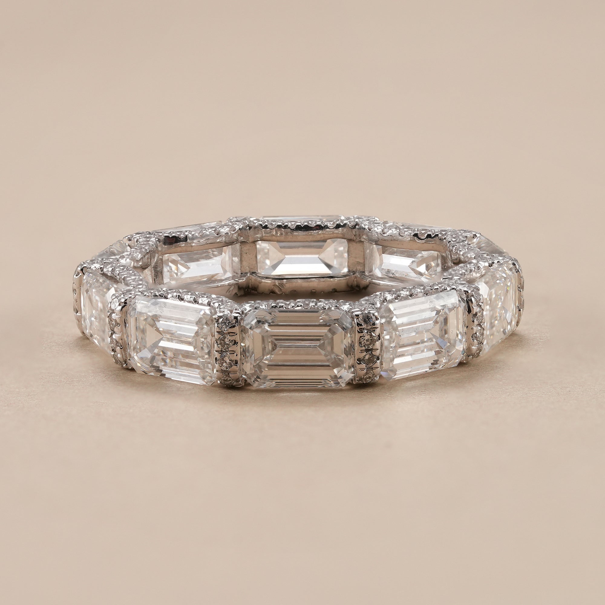 Emerald cut lab diamond eternity band with full diamond design.