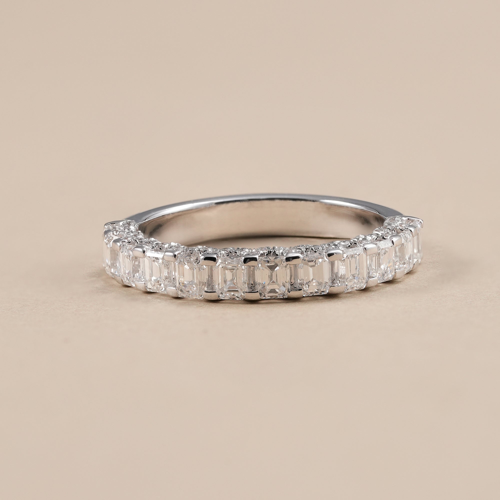 Emerald cut lab grown diamond half eternity wedding band in solid gold