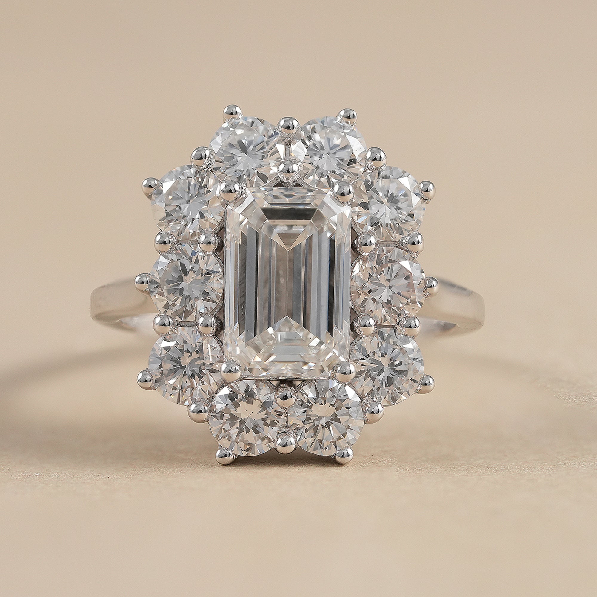 Emerald cut lab grown diamond floral halo engagement ring