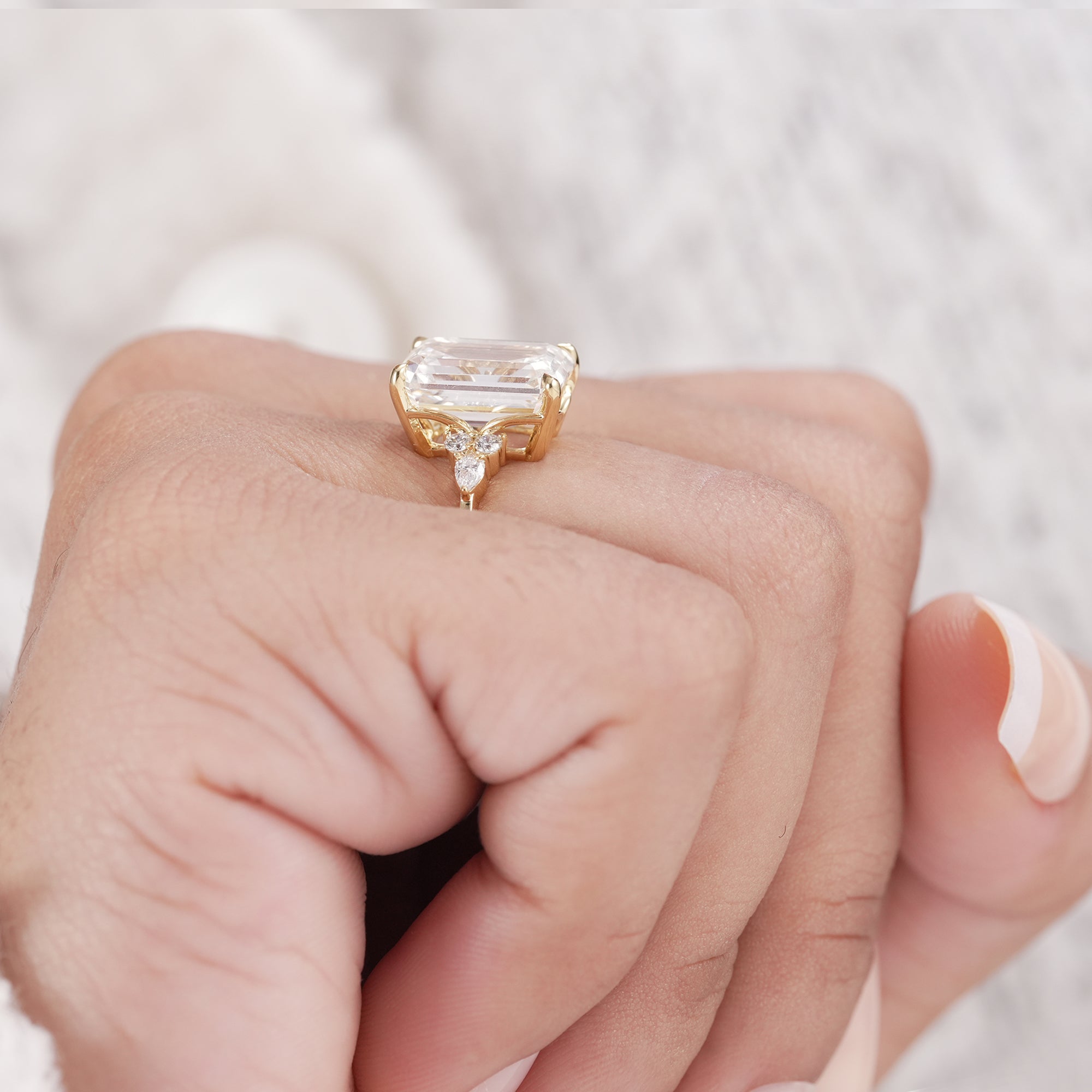 Lab grown diamond ring with pear and round side stones