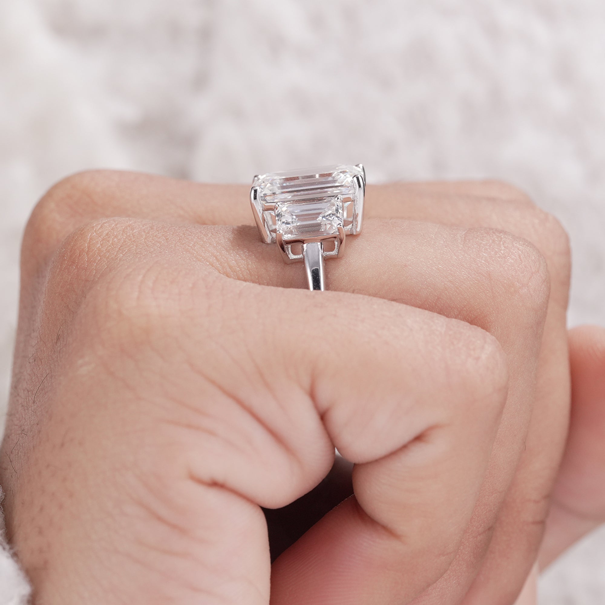 Emerald cut diamond ring with tapered side stones