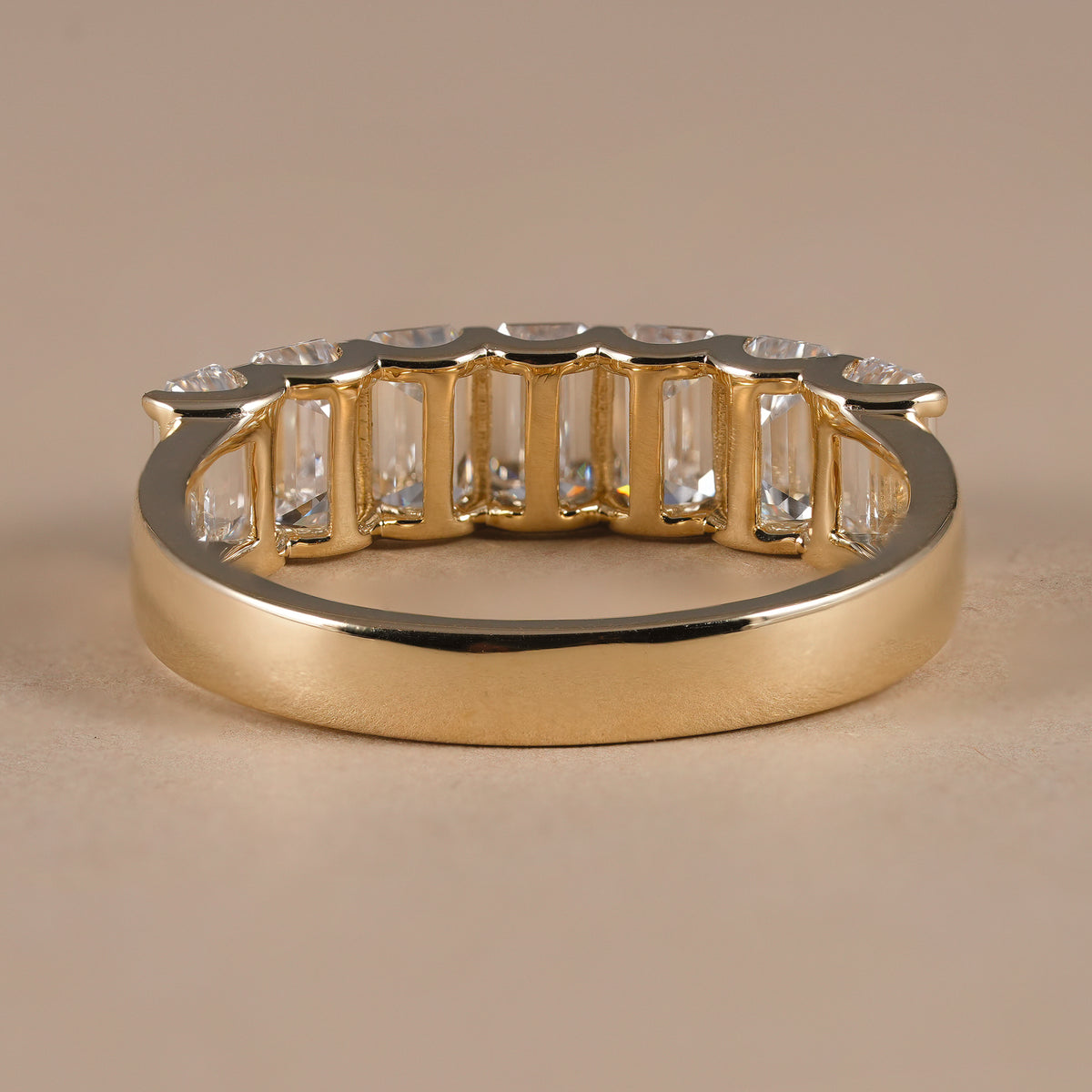 Emerald cut diamond eternity ring crafted in solid gold with exceptional sparkle and brilliance.