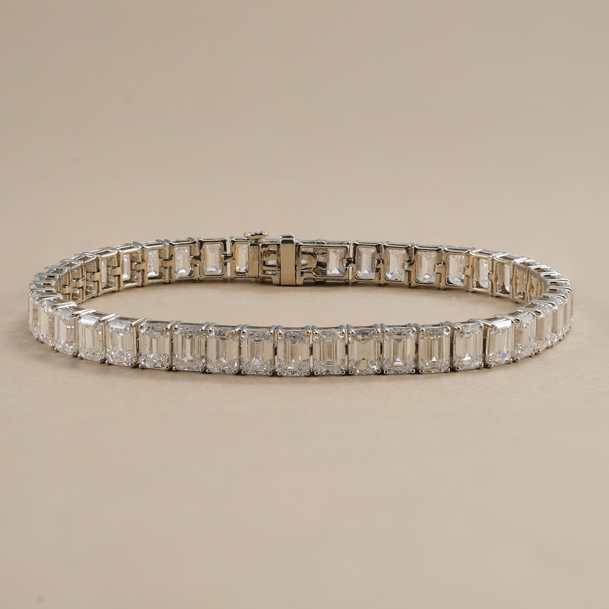 Emerald lab diamond tennis bracelet with brilliant emerald-cut diamonds.